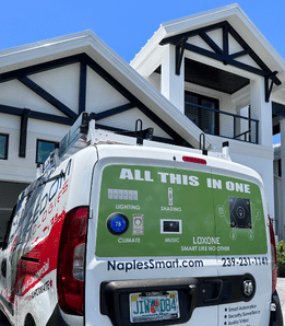 Freedom Technologies service van wrapped with smart home and security capabilities, parked outside a Naples home