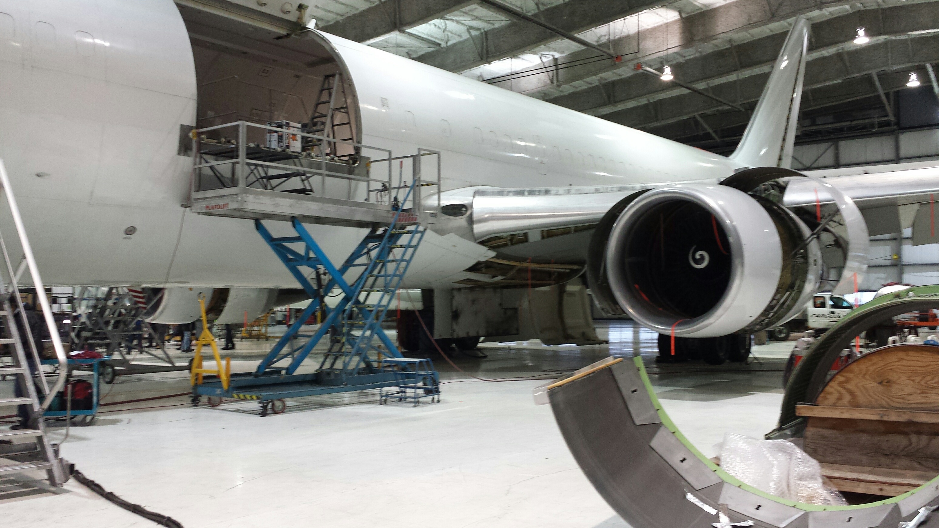 Aircraft maintenance team inspecting avionics systems.