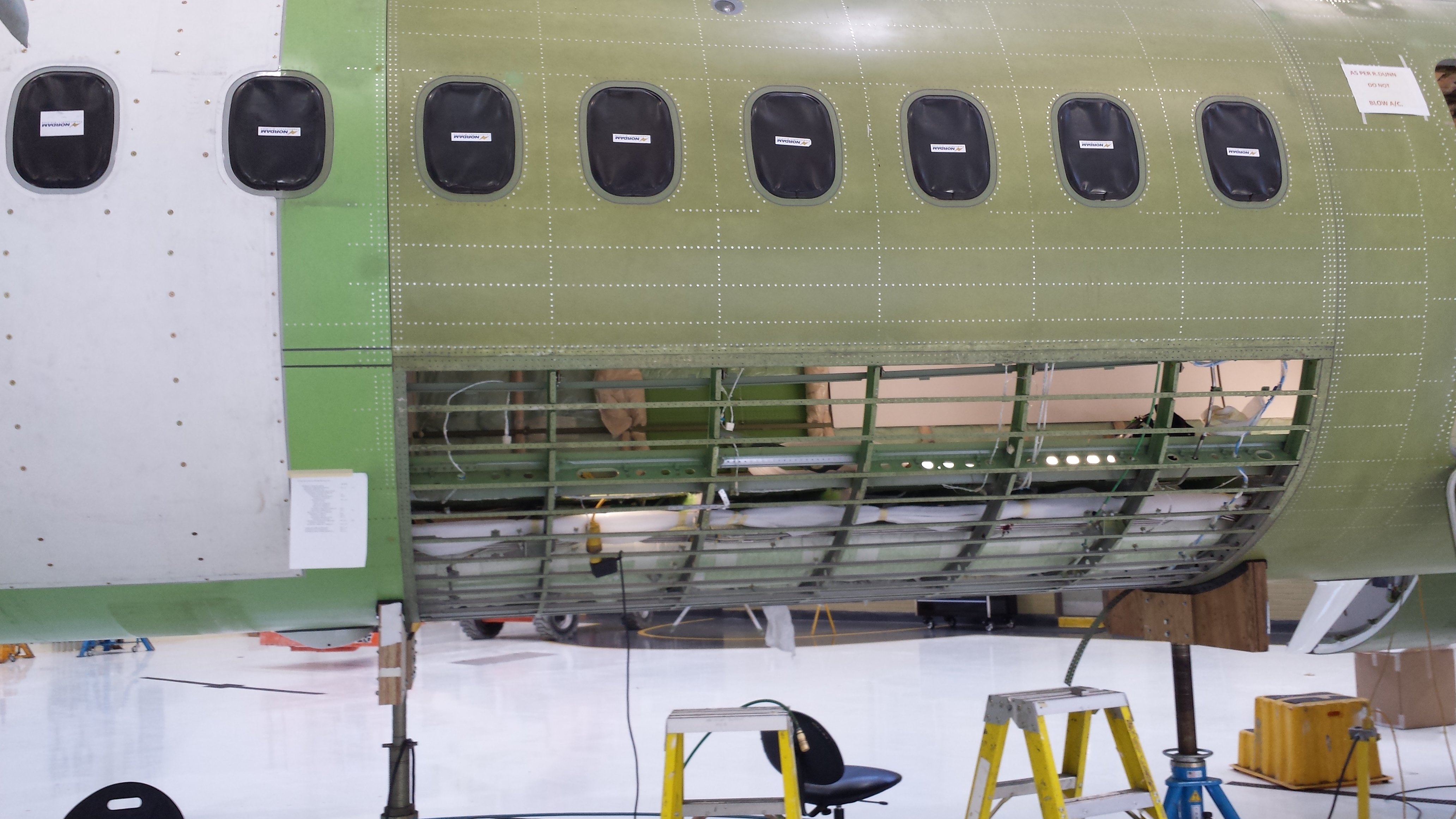 Drilling and riveting aircraft structure components.