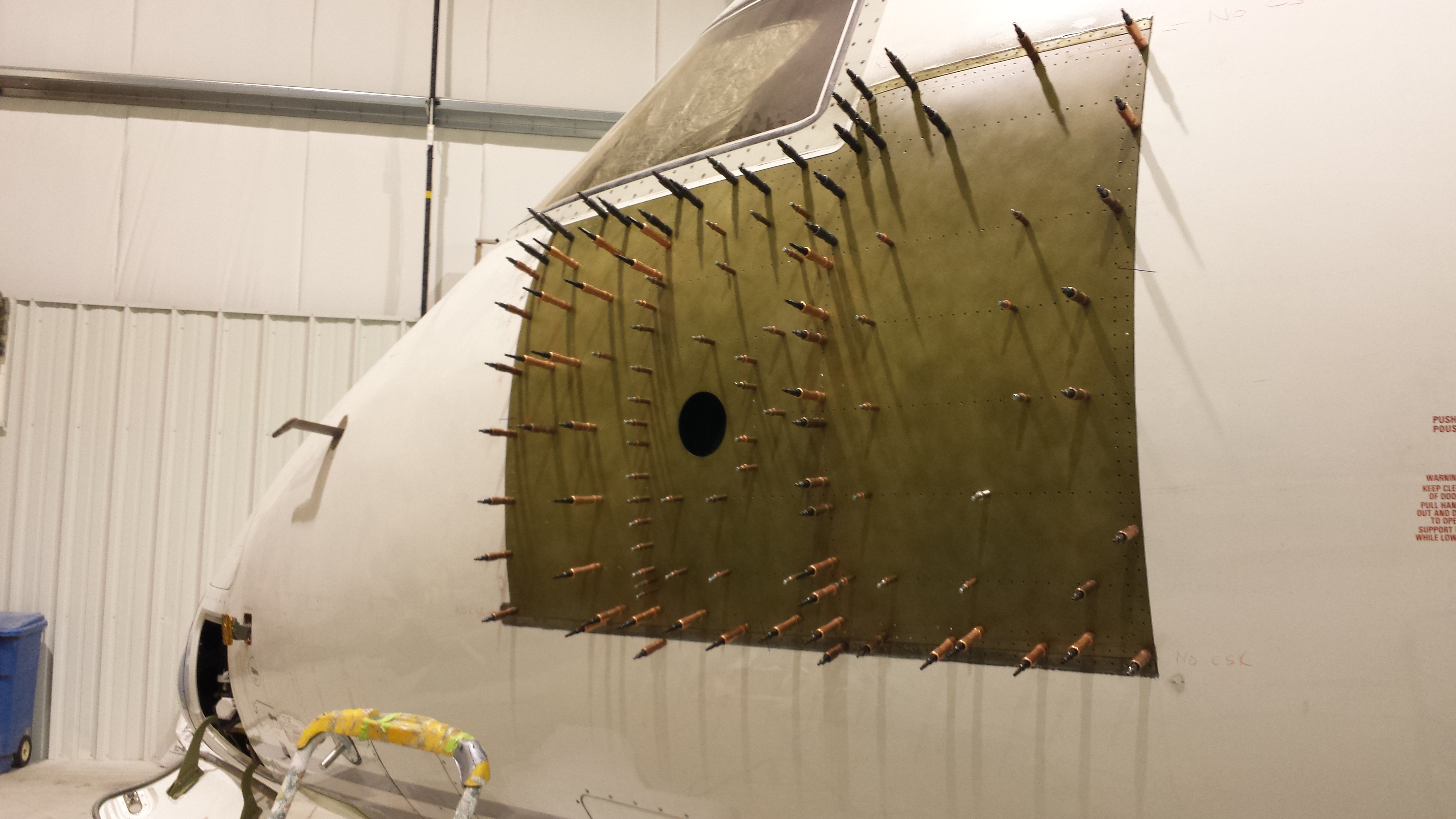 Drilling and riveting aircraft structure components.