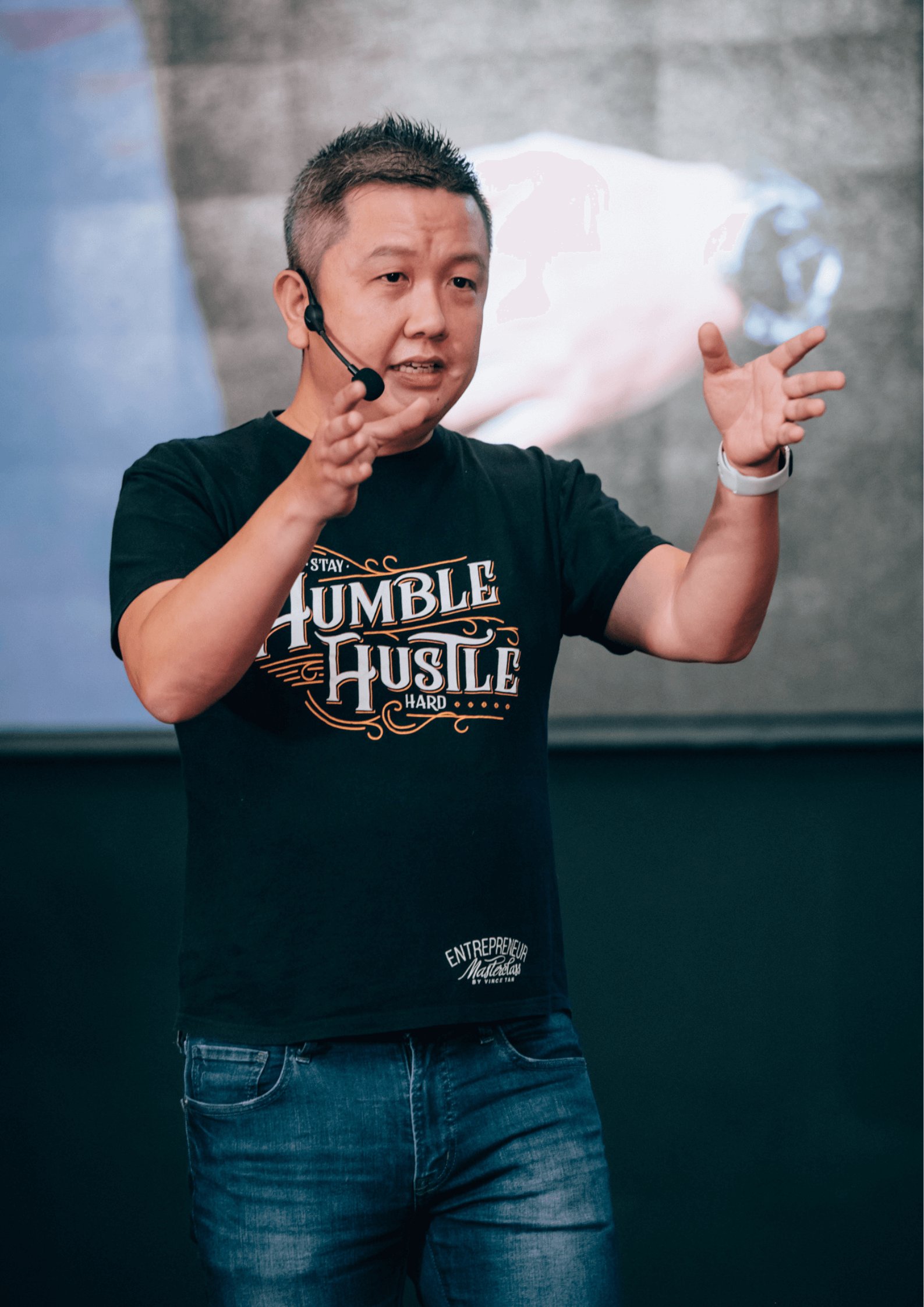 Vince Tan speaking on stage