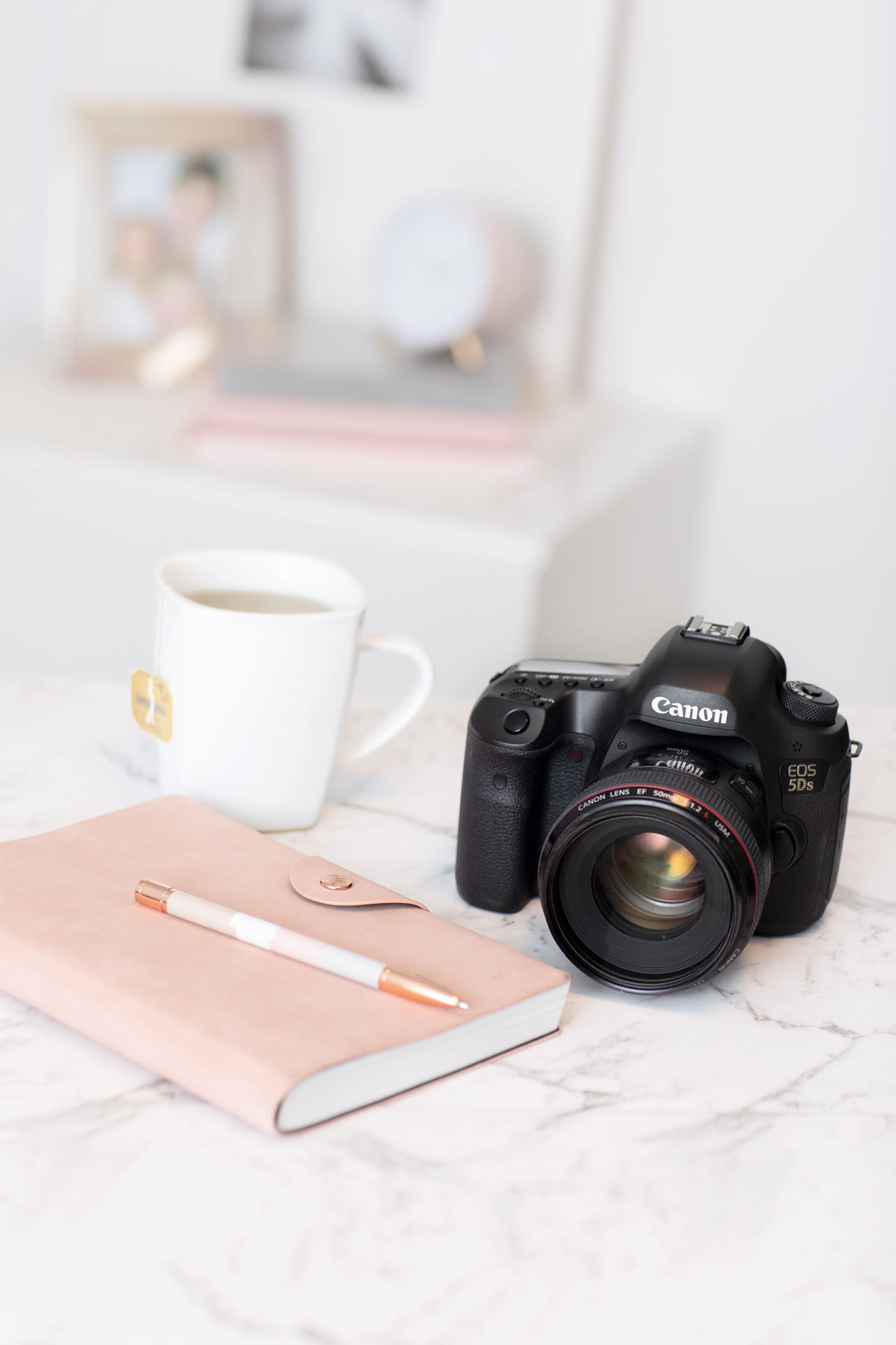 Personal Branding image of a camera, notebook, pen and cup of tea