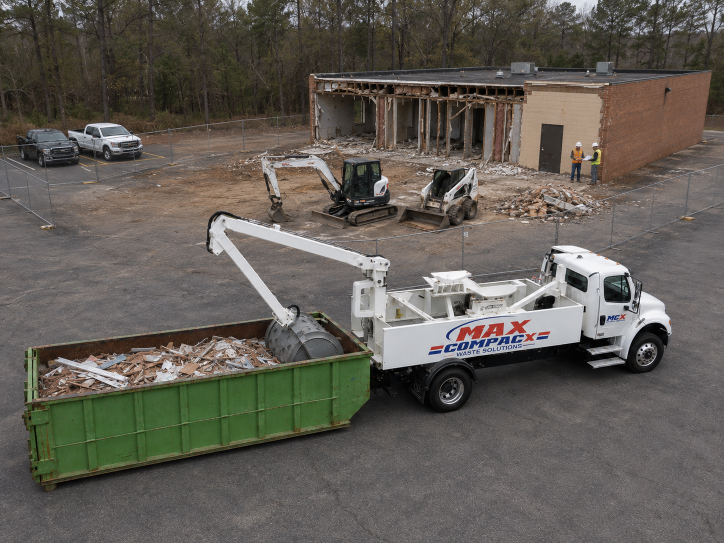 Compaction pass on a mixed construction load with the crew working behind on a South Bibb jobsite