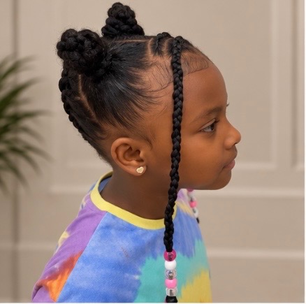 Kids braided bun with beaded braid, side view