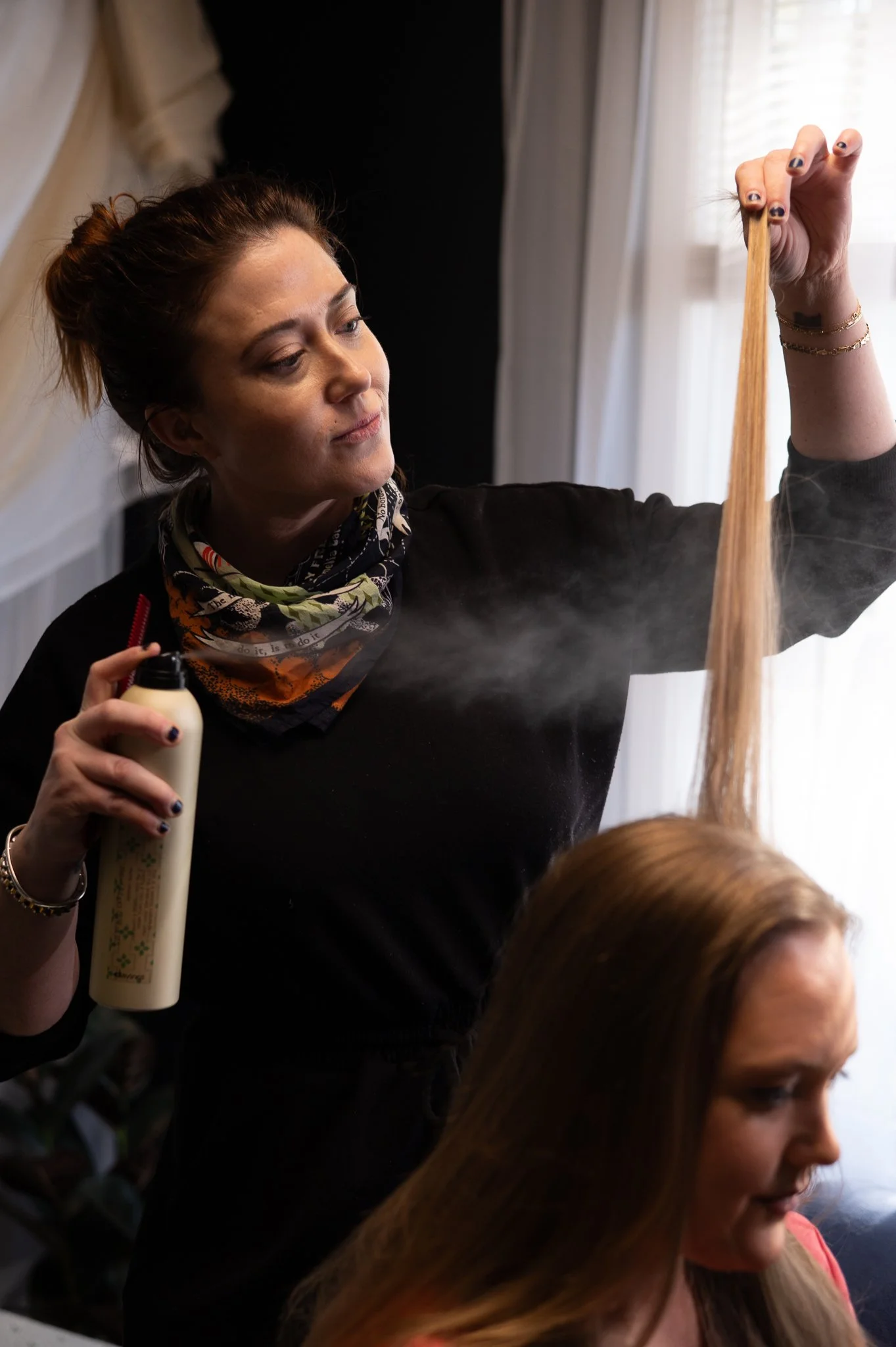 branding image of a hair and makeup artist with client