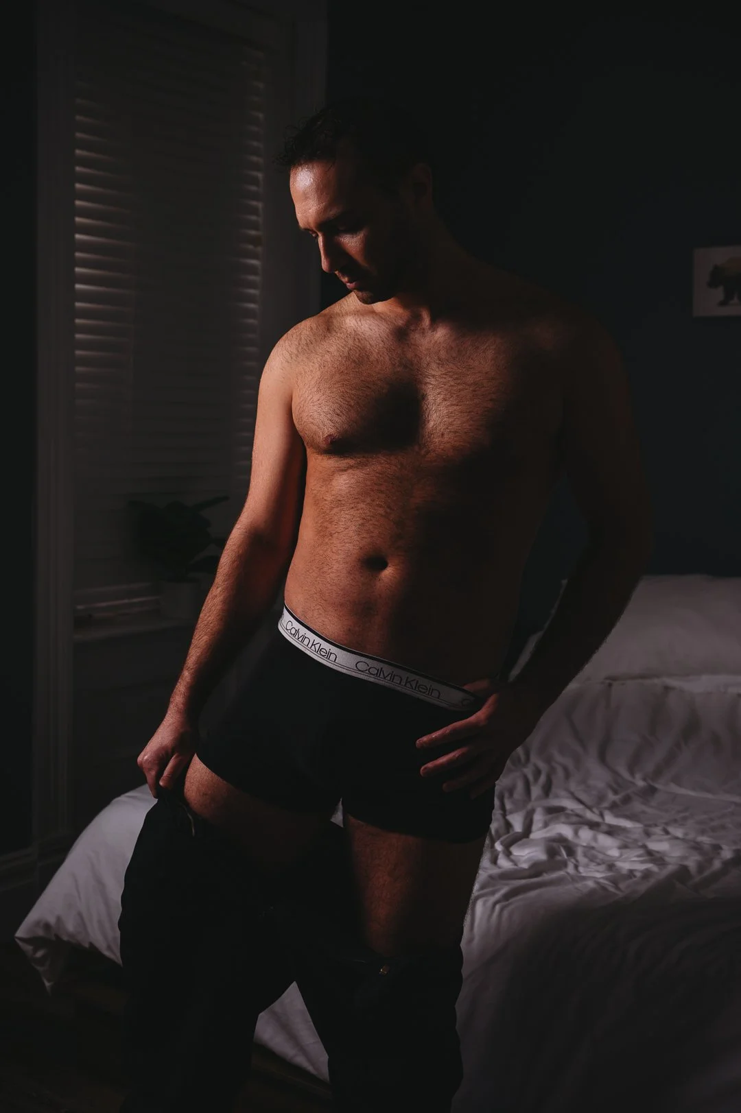 image of a man undressing