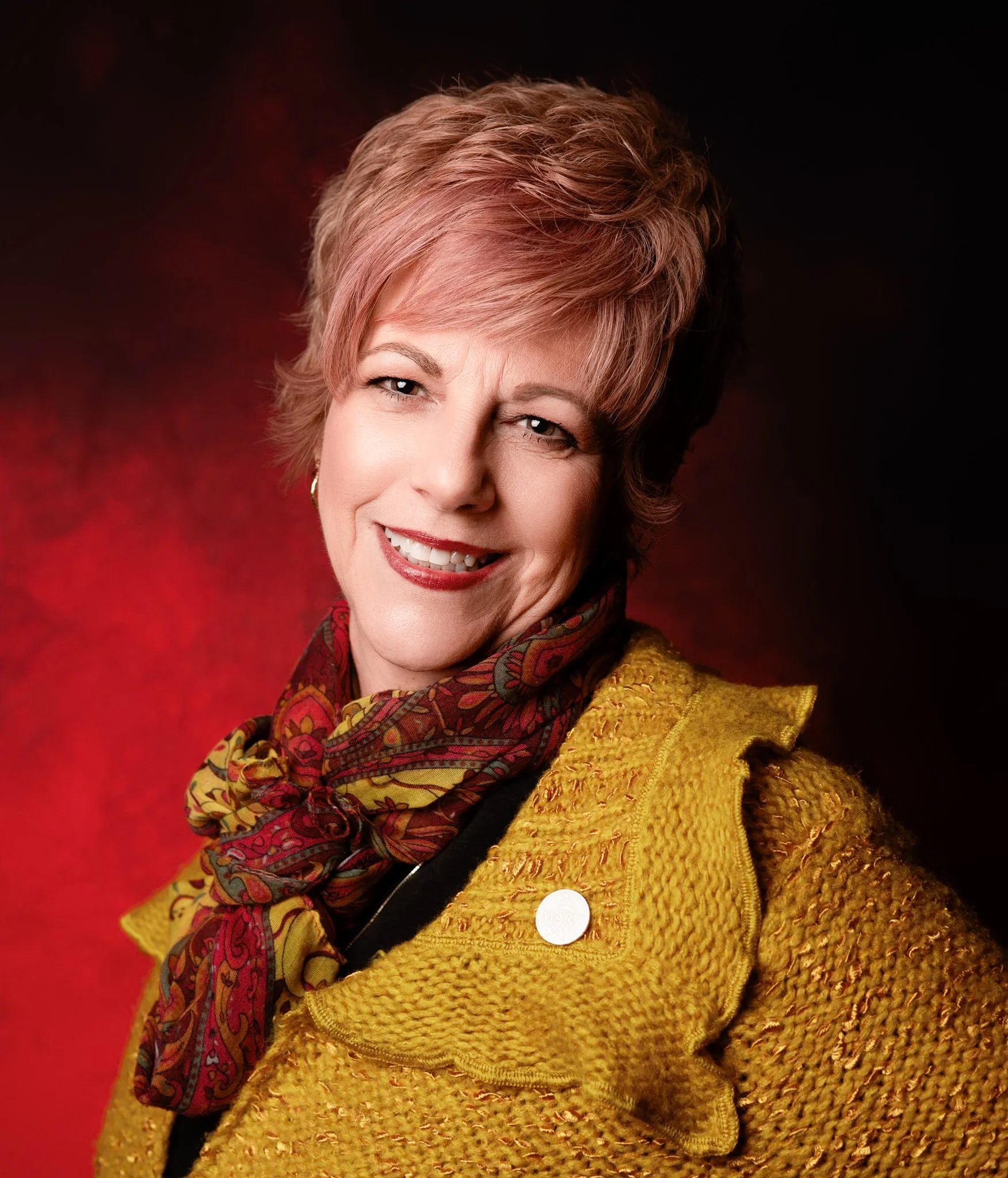 headshot of a beautiful older woman who is a Mary kay representative