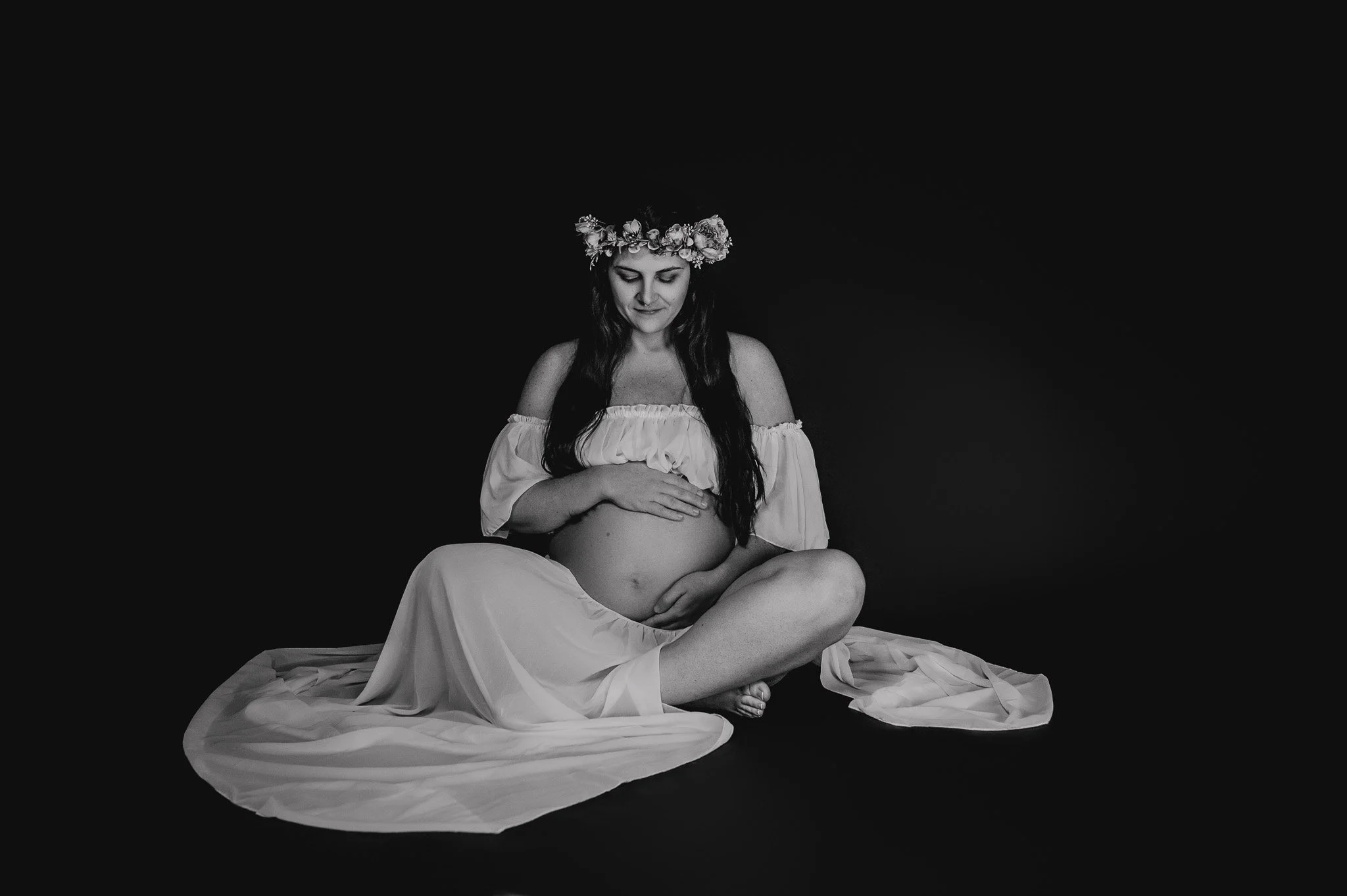 pregnant woman holding belly