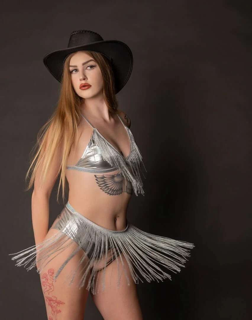 young woman dancing in beaded skirt