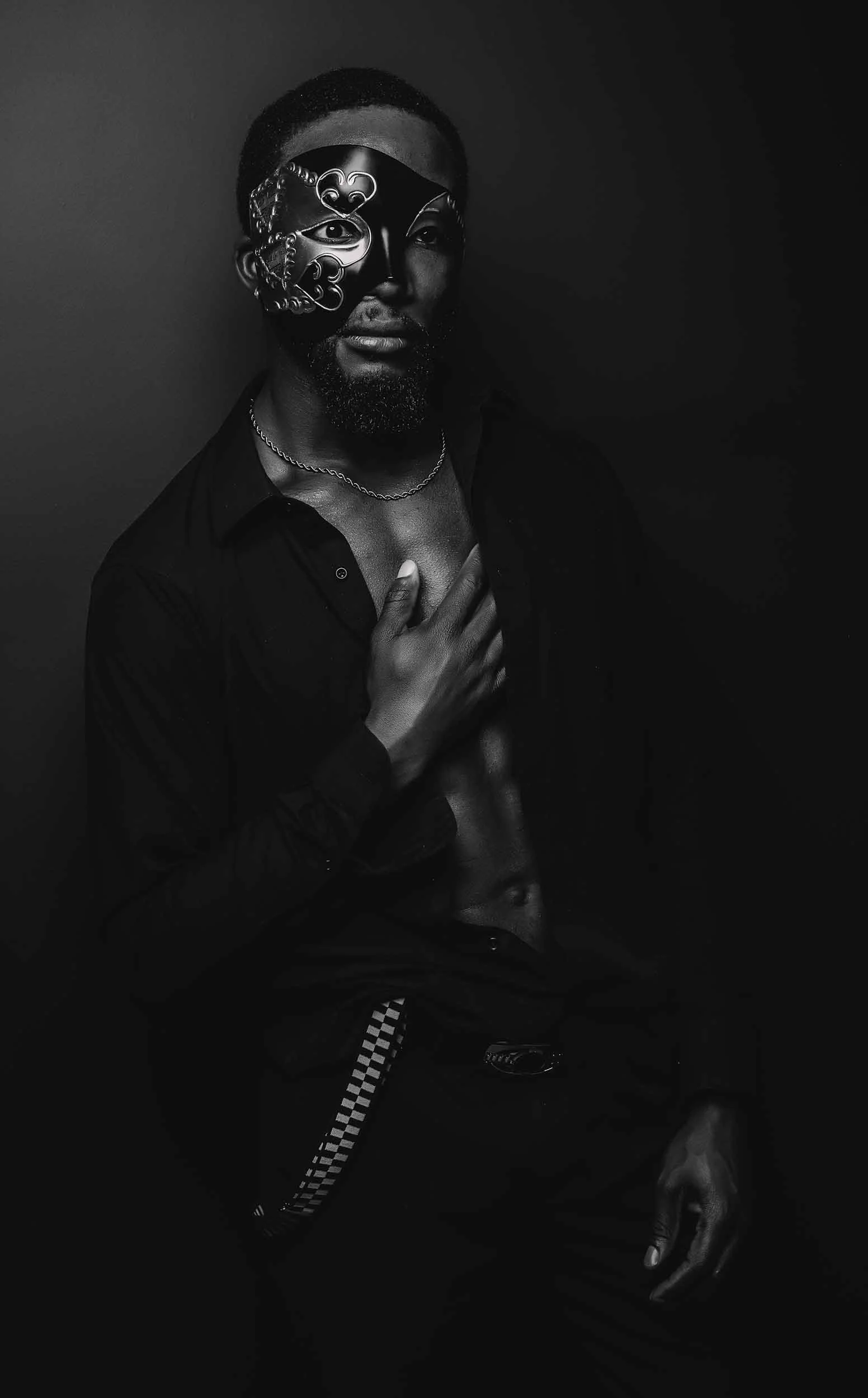 man showing chest muscles wearing mask