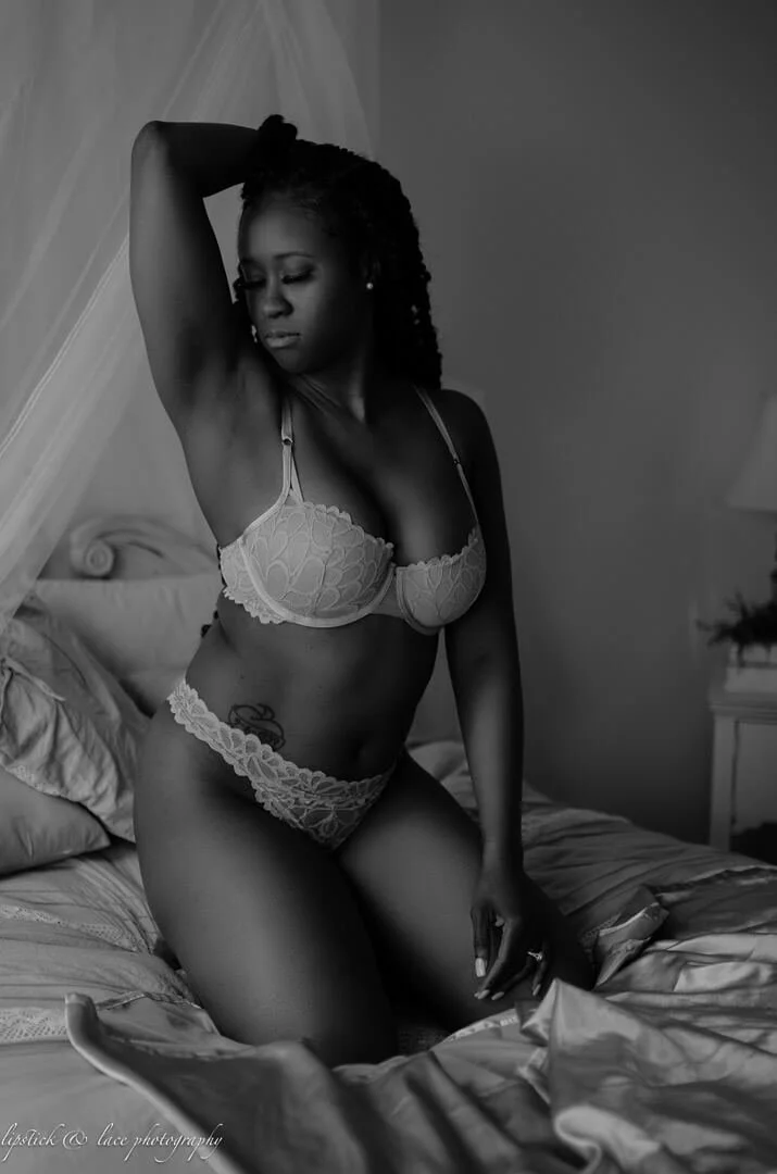 woman with braids in lingerie on bed