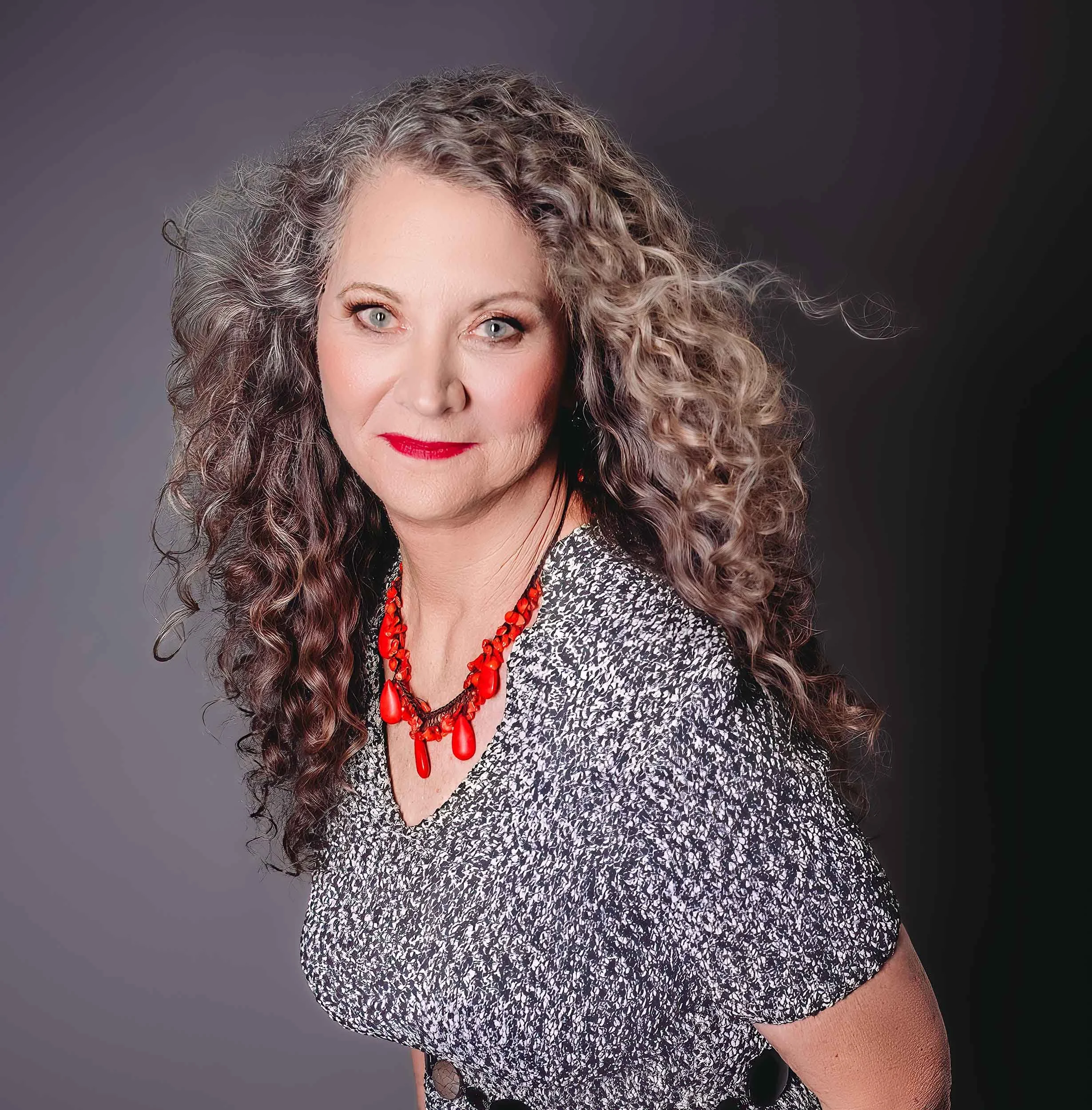 mature woman with windswept hair