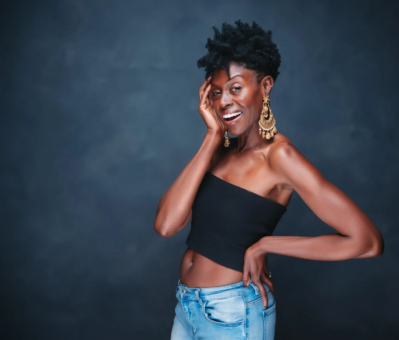 beautiful black woman with gold earrings