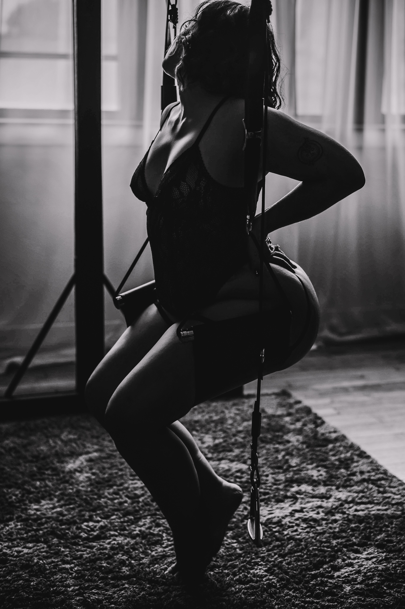 plus sized woman sitting on a swing