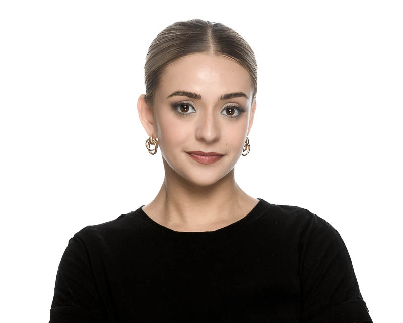 Professional headshot of a business professional in studio