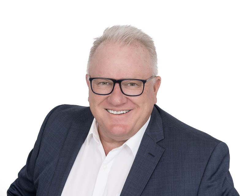 Professional headshot of a networking group member in studio