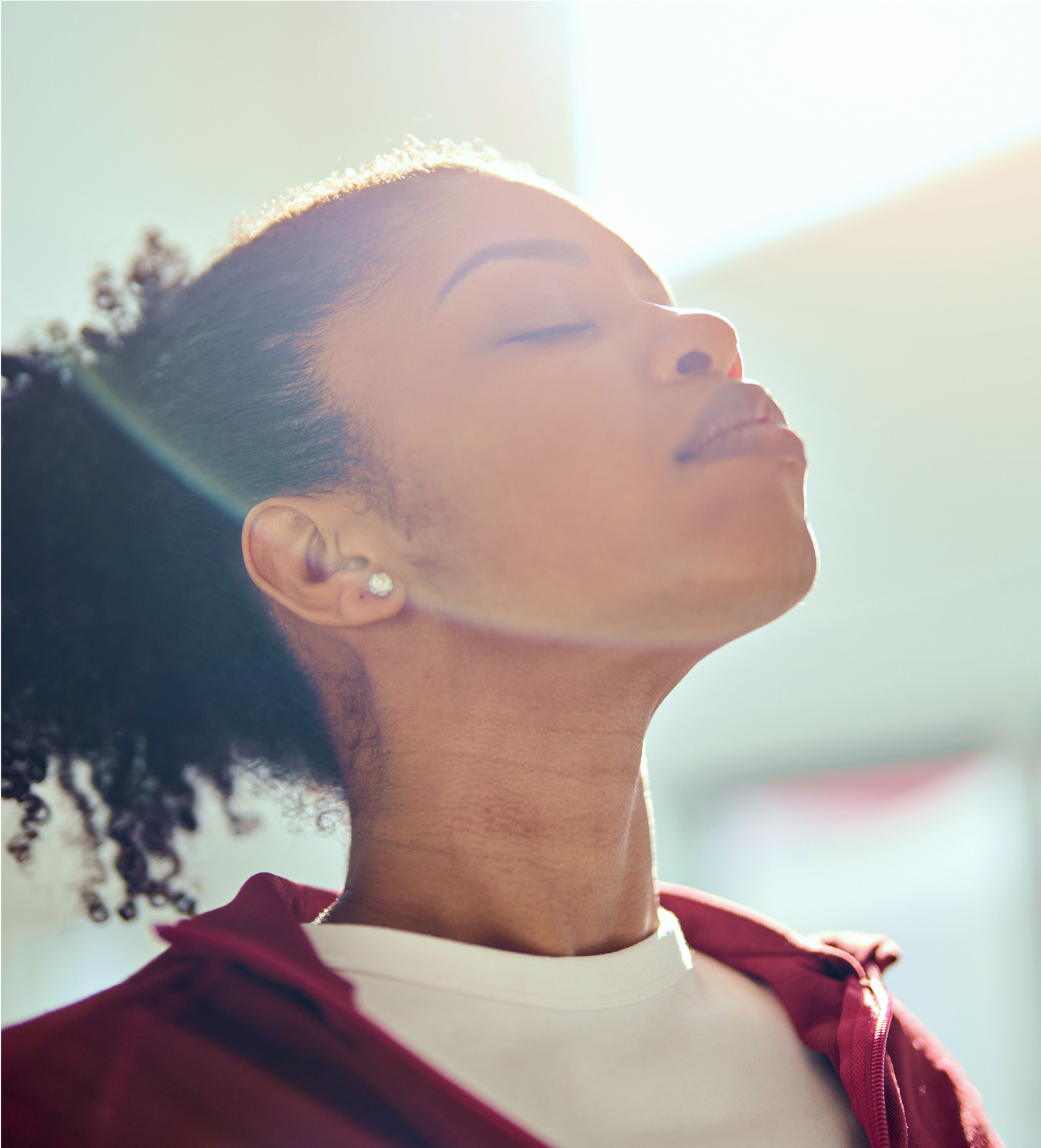 Woman resting outdoors in warm sunlight