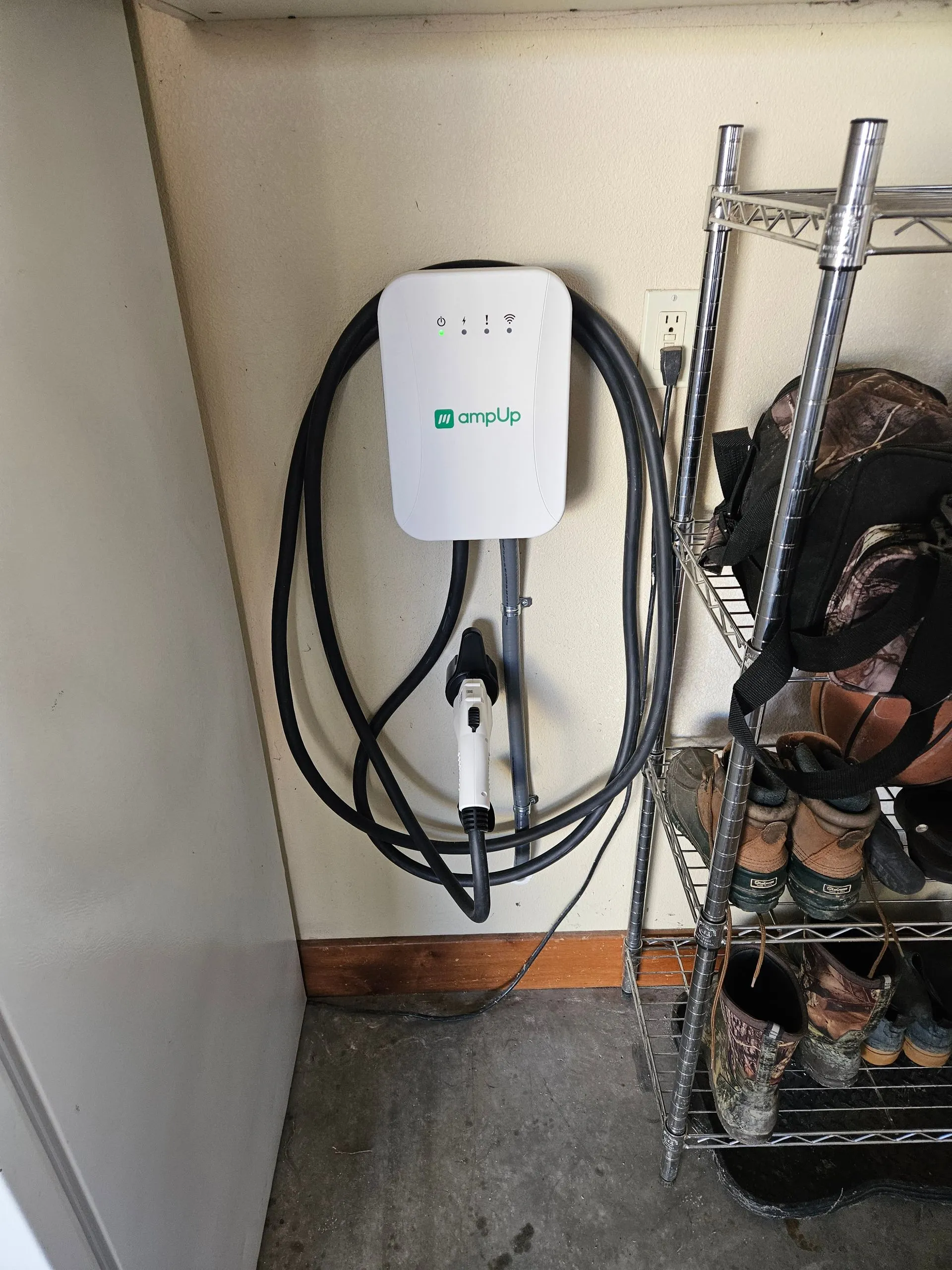 ampUp Level 2 EV charger hardwired with conduit in a Northern Colorado garage