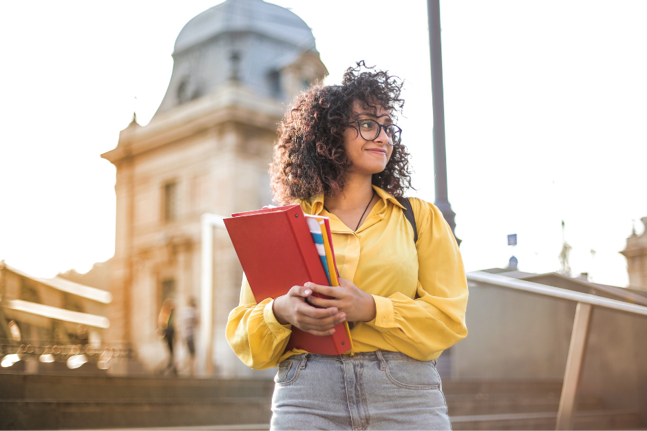 College students holding books