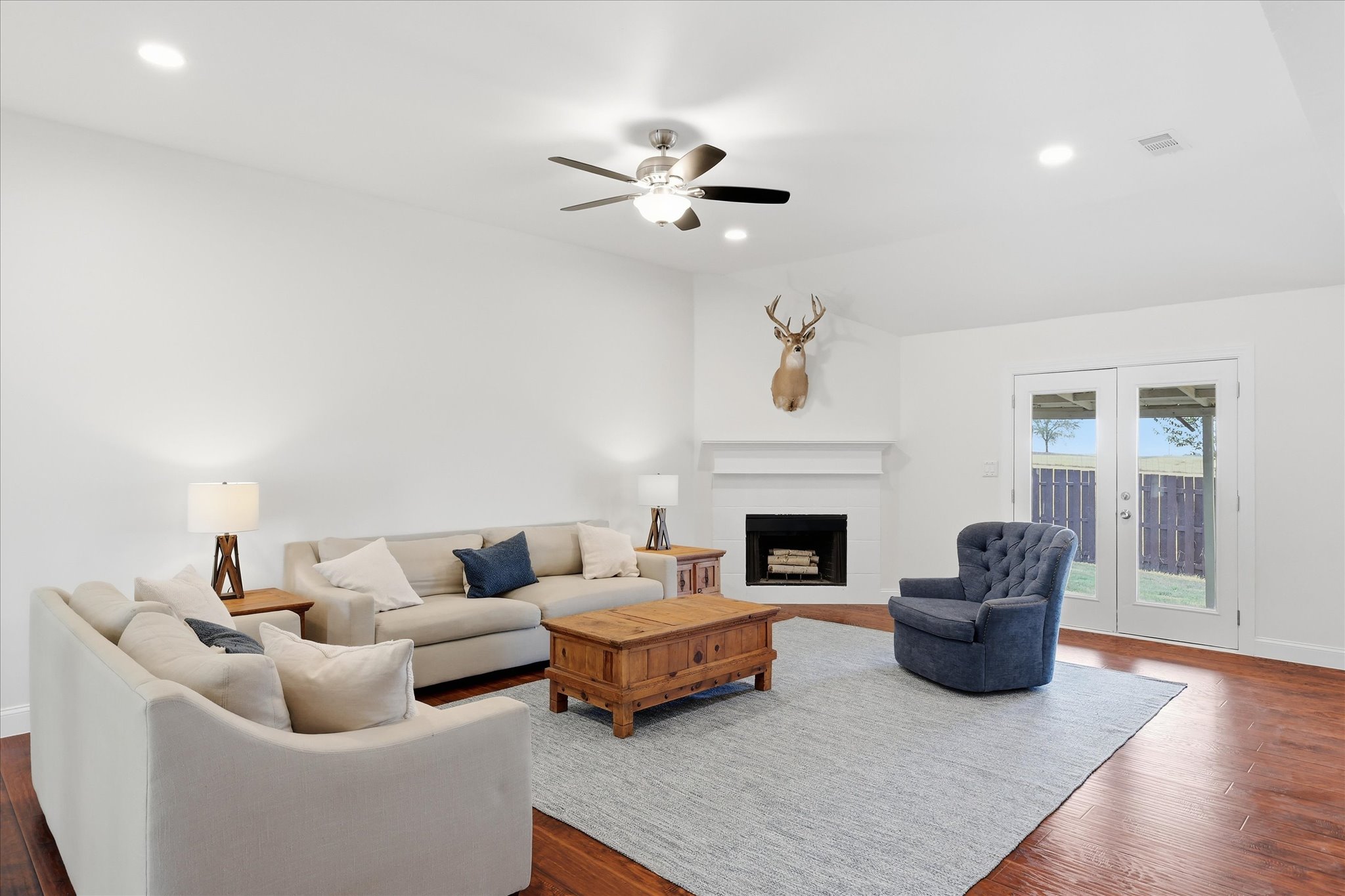 Open living room with LVP flooring at 208 Cory Court in Krum, Texas
