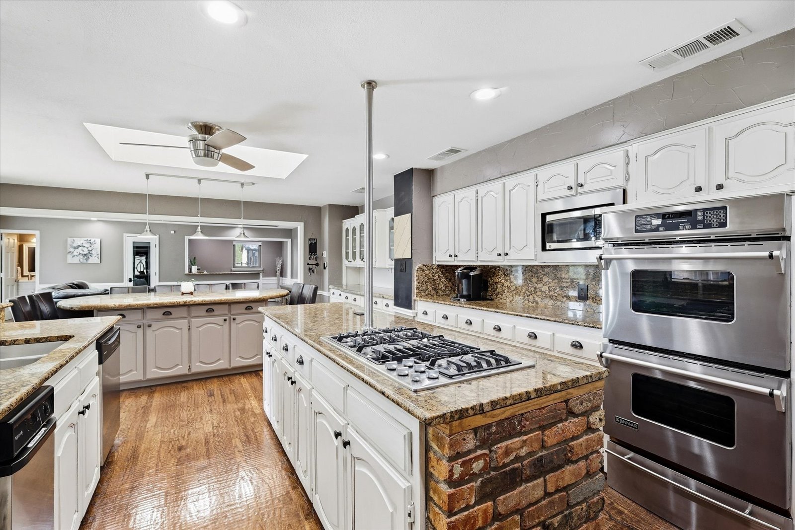 Kitchen with gas cooktop and double ovens at 3801 Post Oak Road in Flower Mound