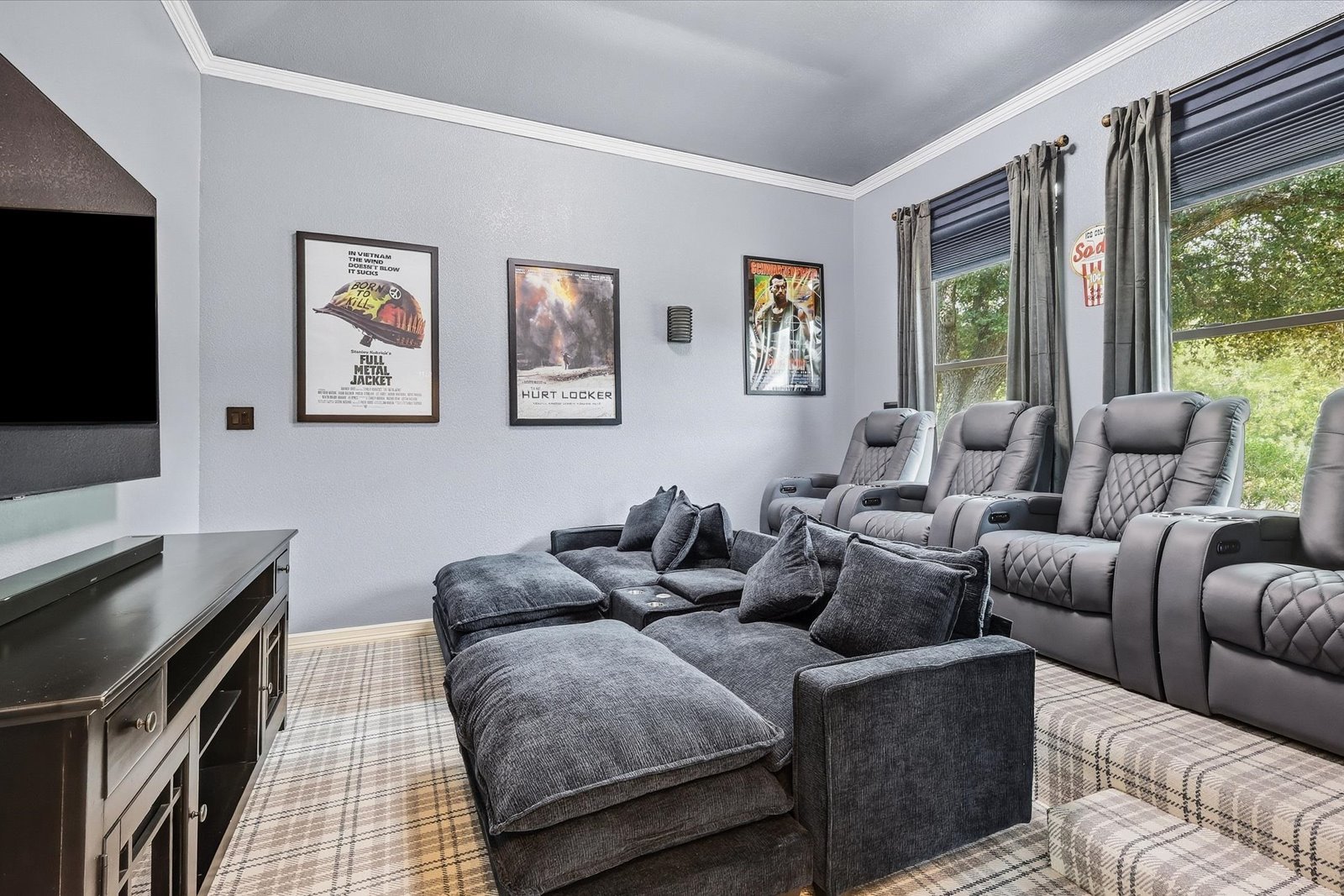 Home theater with surround sound and stadium seating at 3801 Post Oak Road