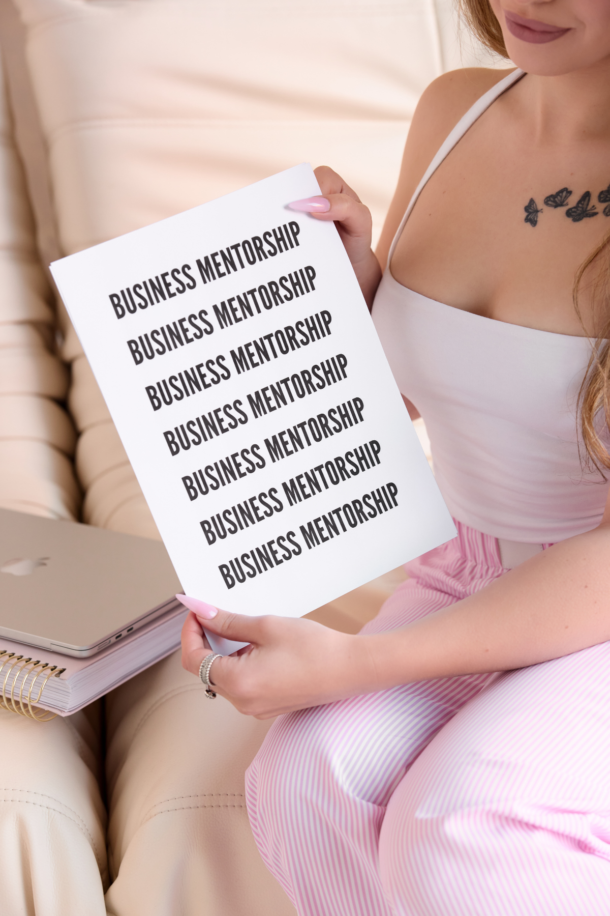 Monique holding a Business Mentorship workbook