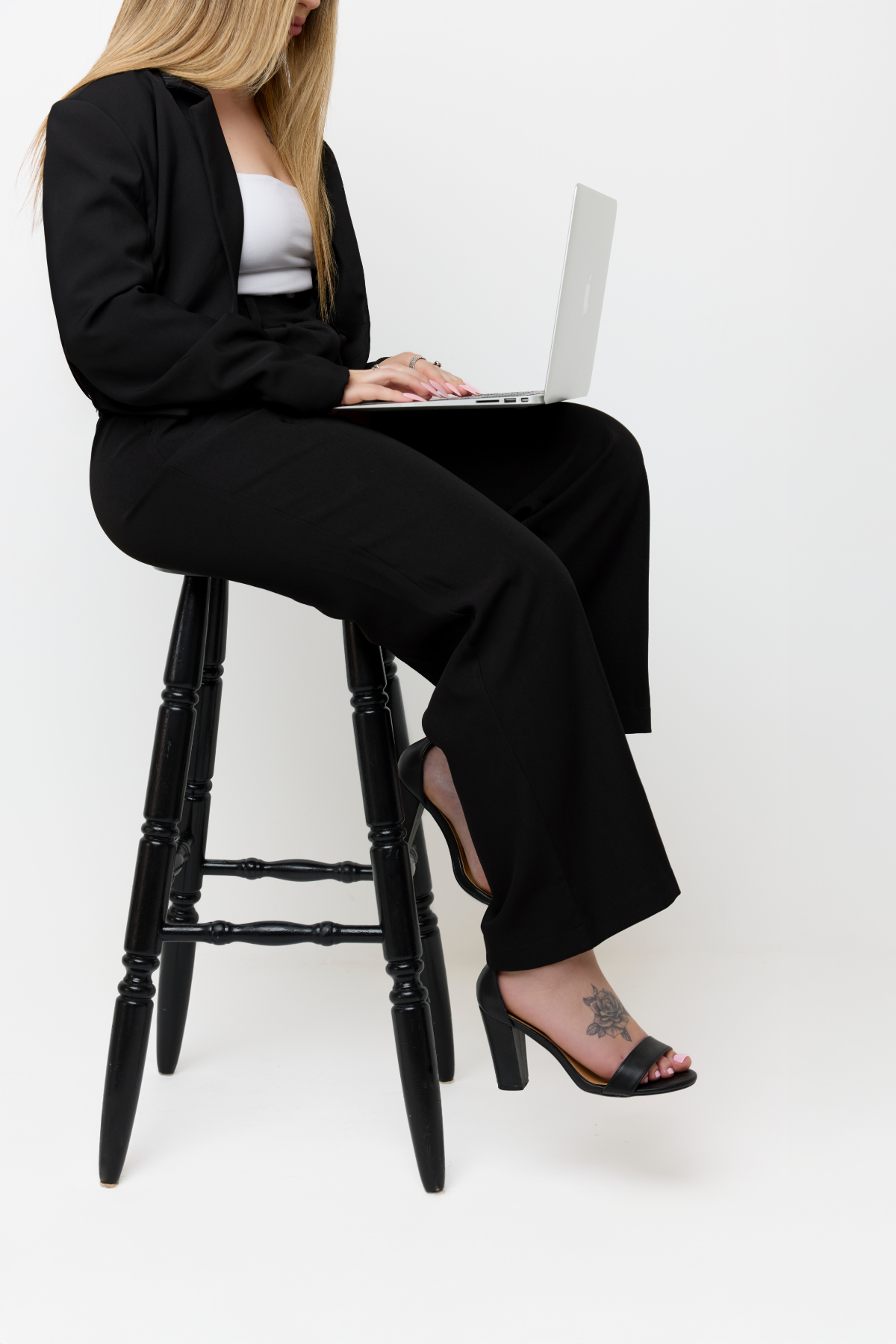 Monique with laptop, seated