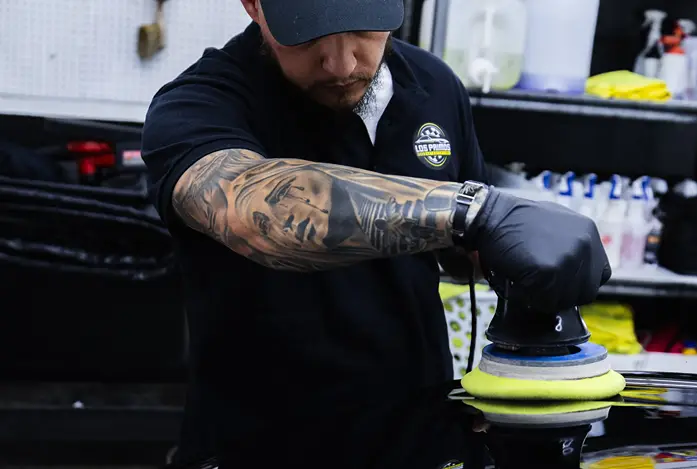 Window tints on car with rain drops