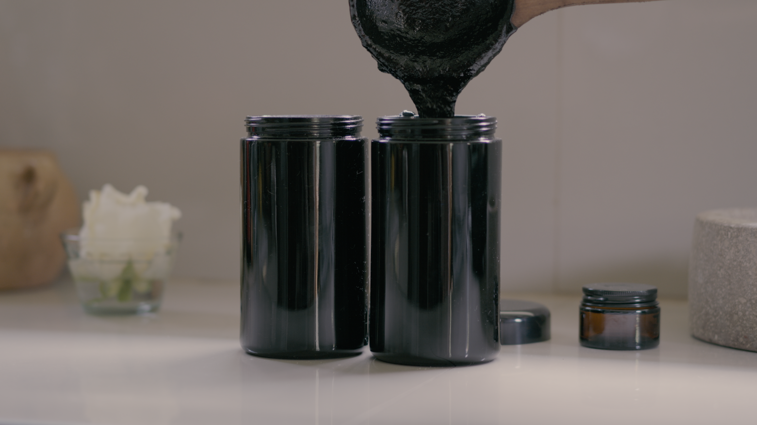 Tobacco paste being poured into jars