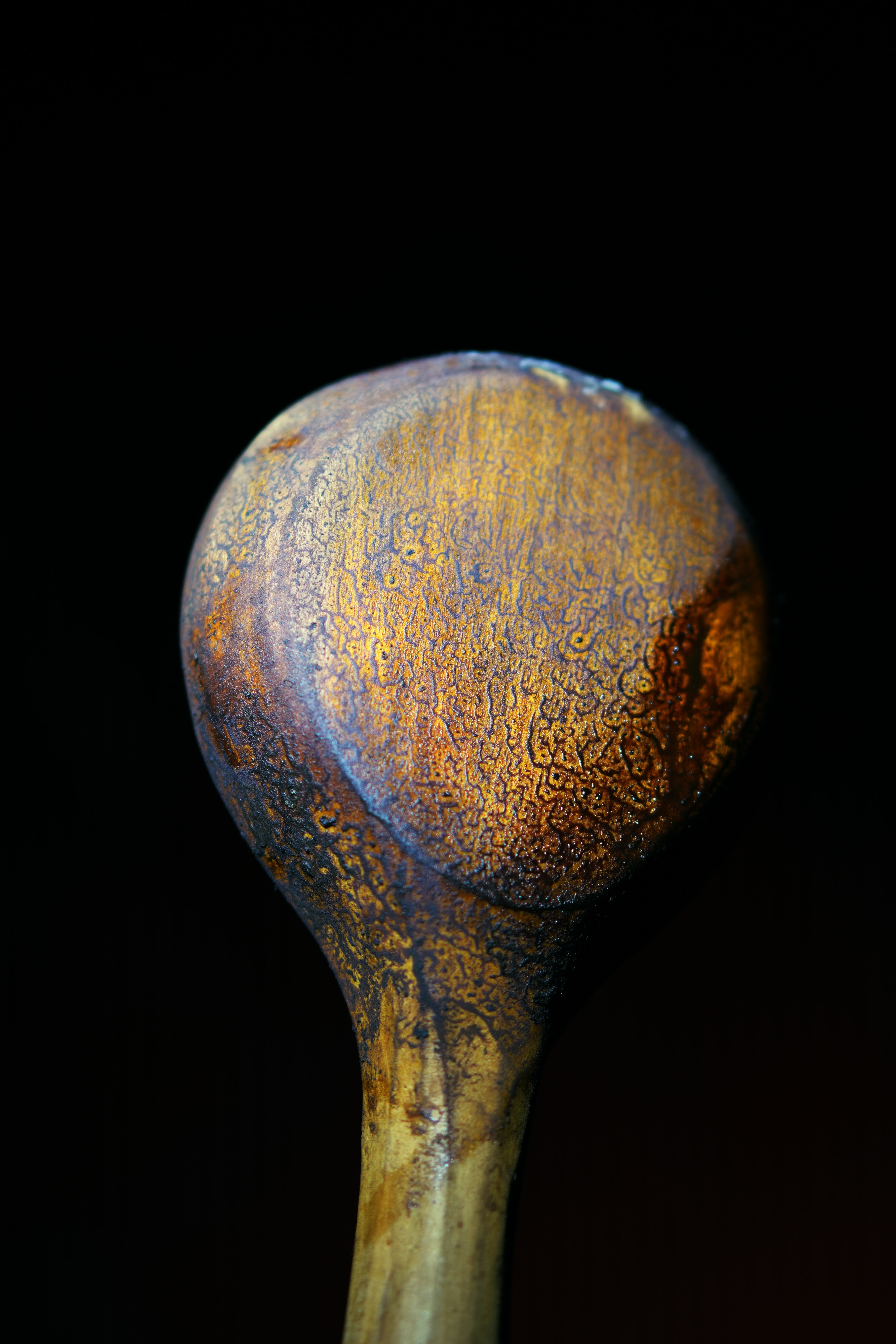 Close-up of a spoon with golden Tobacco residue