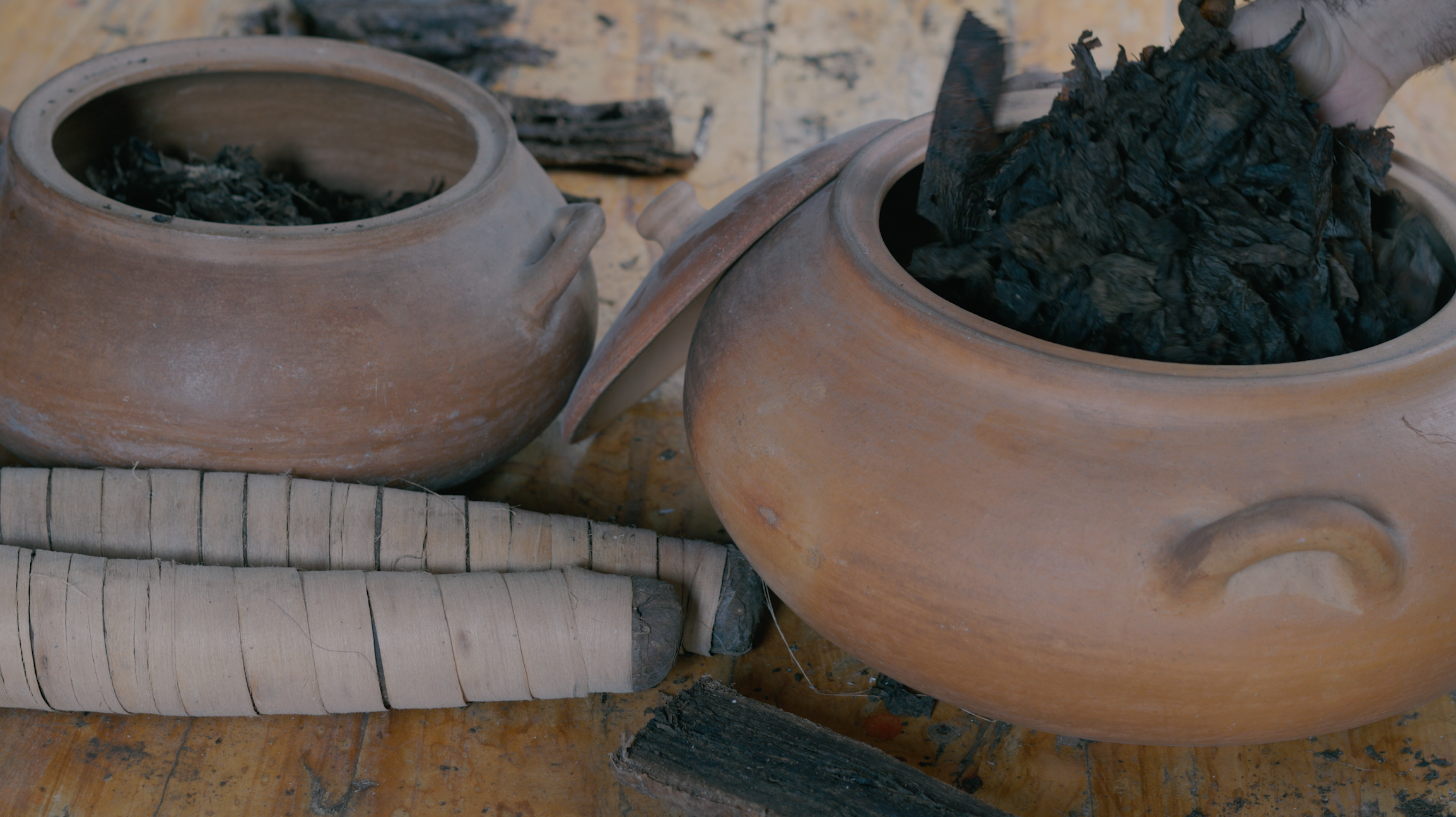 Ceremonial tobacco stored in clay vessels