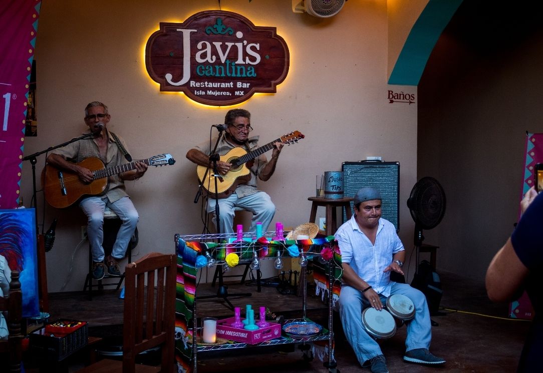 Guests dining during a live performance at Javi's Cantina