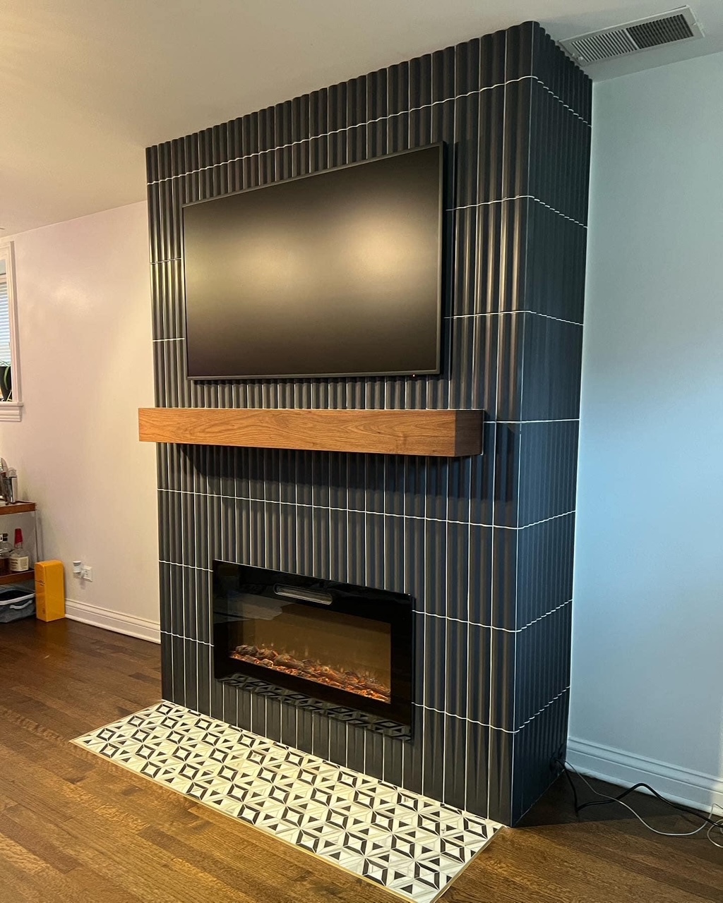 Custom fireplace surround by Artisan Tile and Remodeling