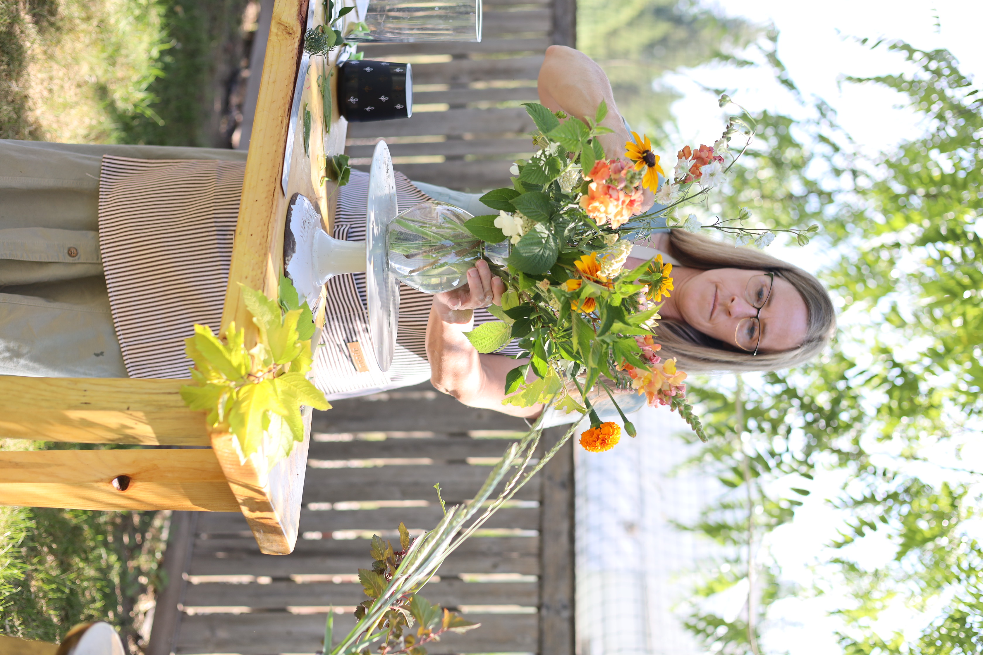 Paula designing a garden-florist arrangement