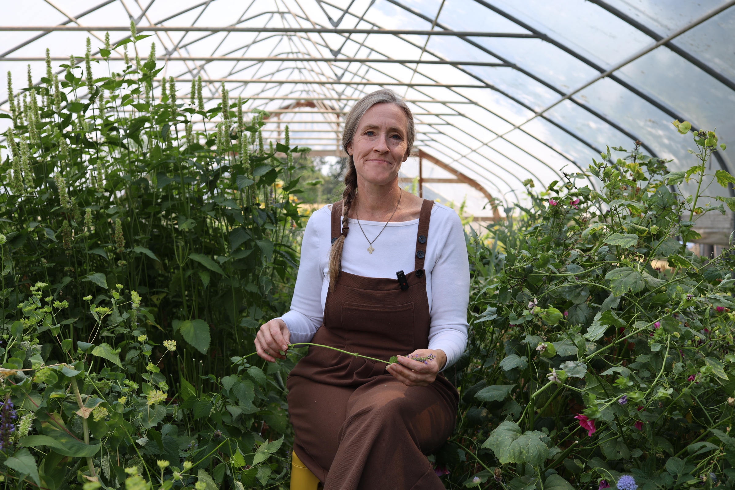 Paula in the hoophouse — tap to watch her story