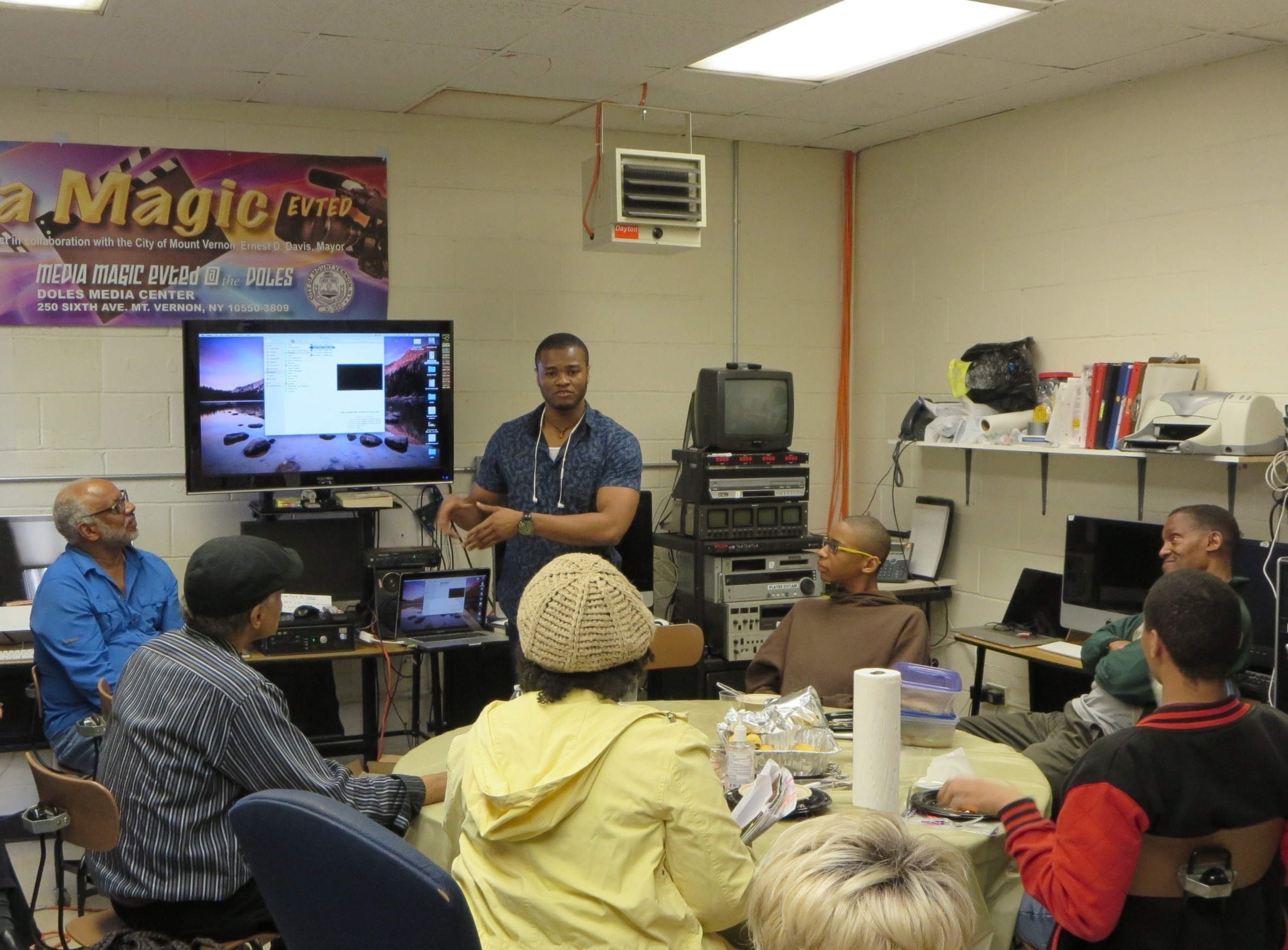 Instructor leading a media production training session with students at EVT Educational Productions in a classroom setting