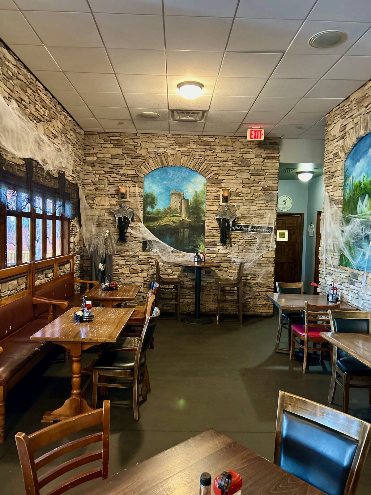 Stone-wall dining room with Irish mural