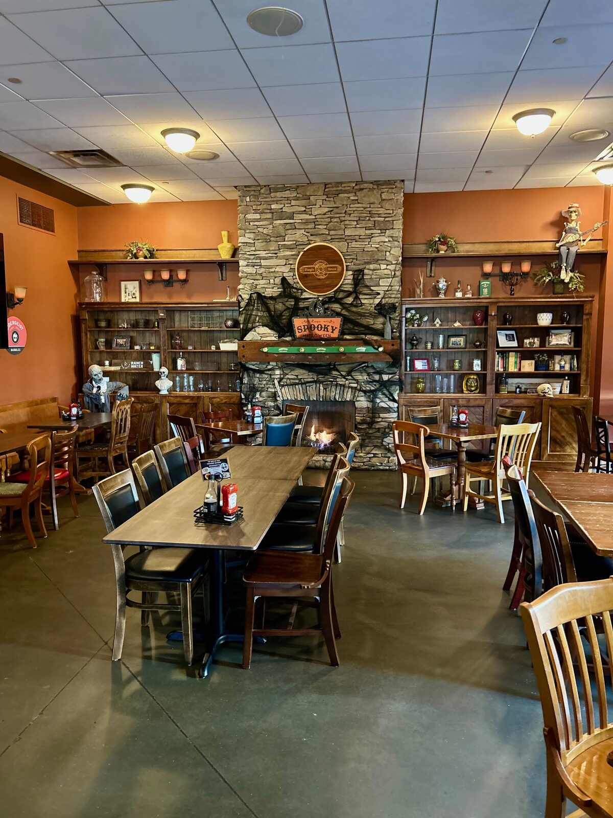 Dining room in front of the stone fireplace