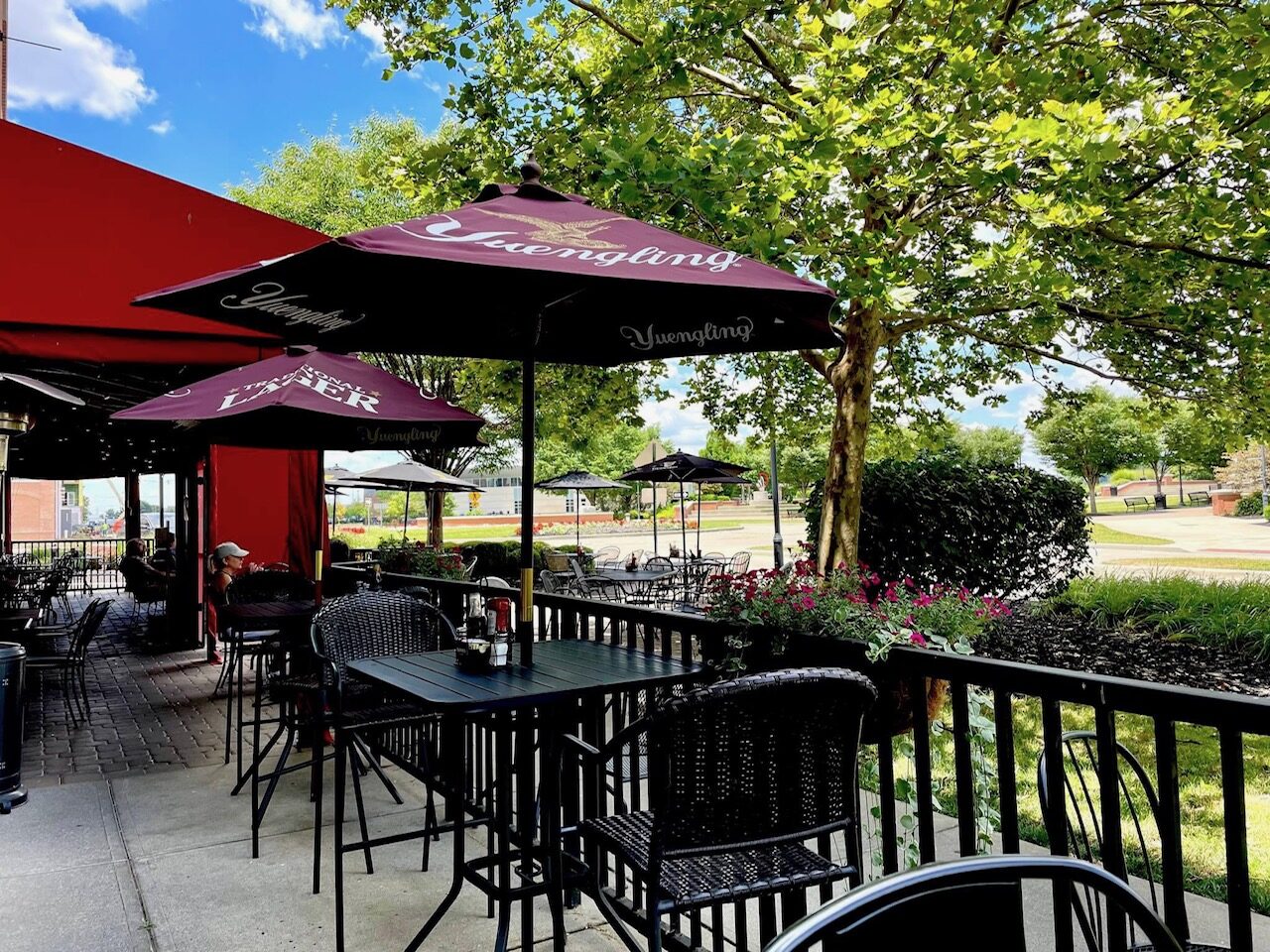 Dingle House patio with Yuengling umbrellas and outdoor seating