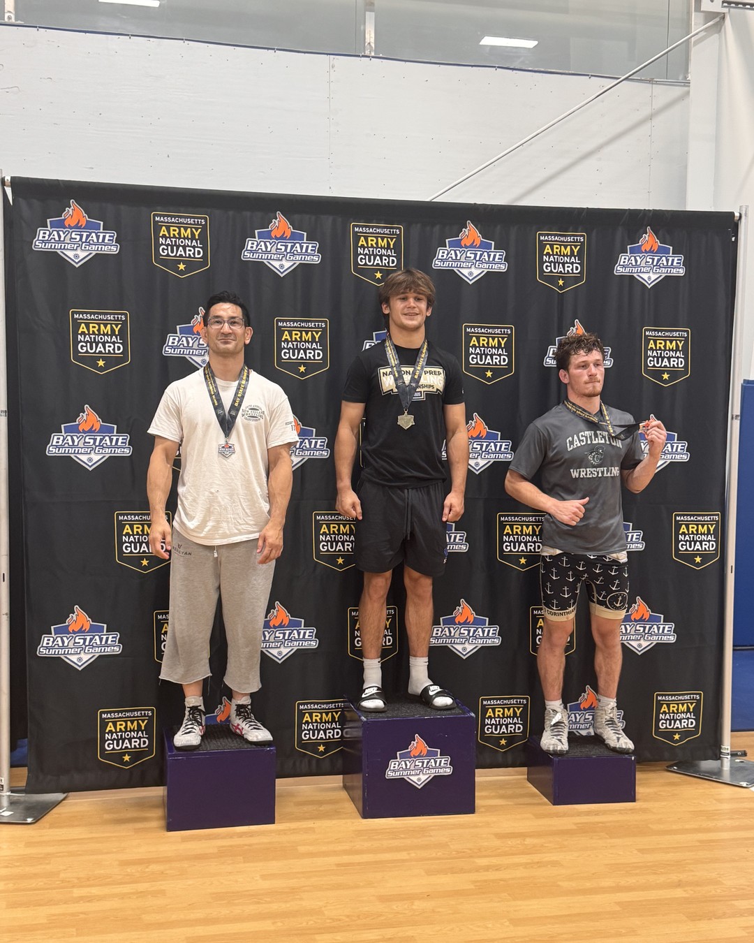 Coach Tomi Uyehara with a silver medal in the adult division at the 2026 Bay State Games