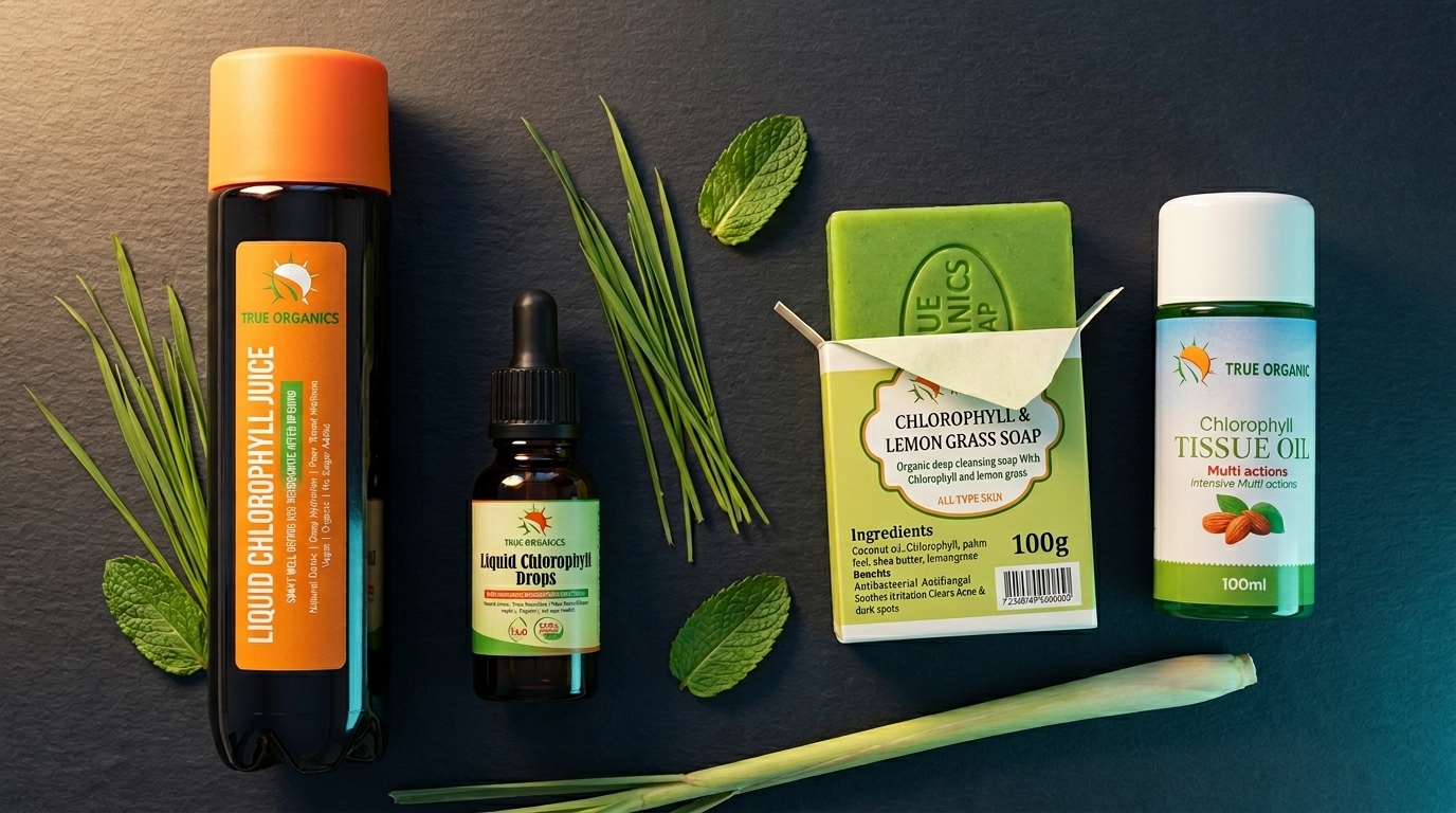 True Organics full product range — Liquid Chlorophyll Juice 500ml, Drops 20ml, Chlorophyll Lemongrass Soap and Chlorophyll Tissue Oil — arranged on a dark surface with fresh herbs