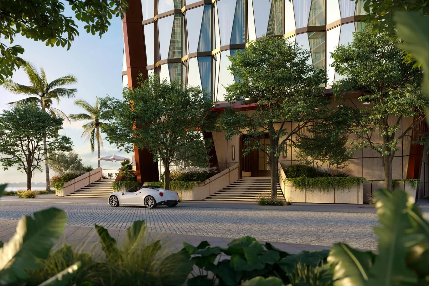 Garden approach to the tower with palms and a parked car