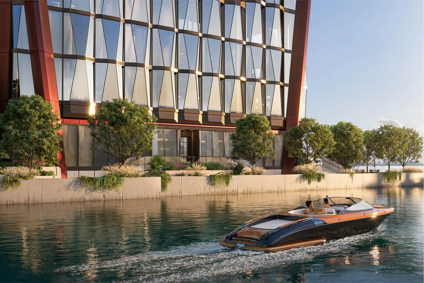A classic wooden speedboat passing the tower's base on the bay