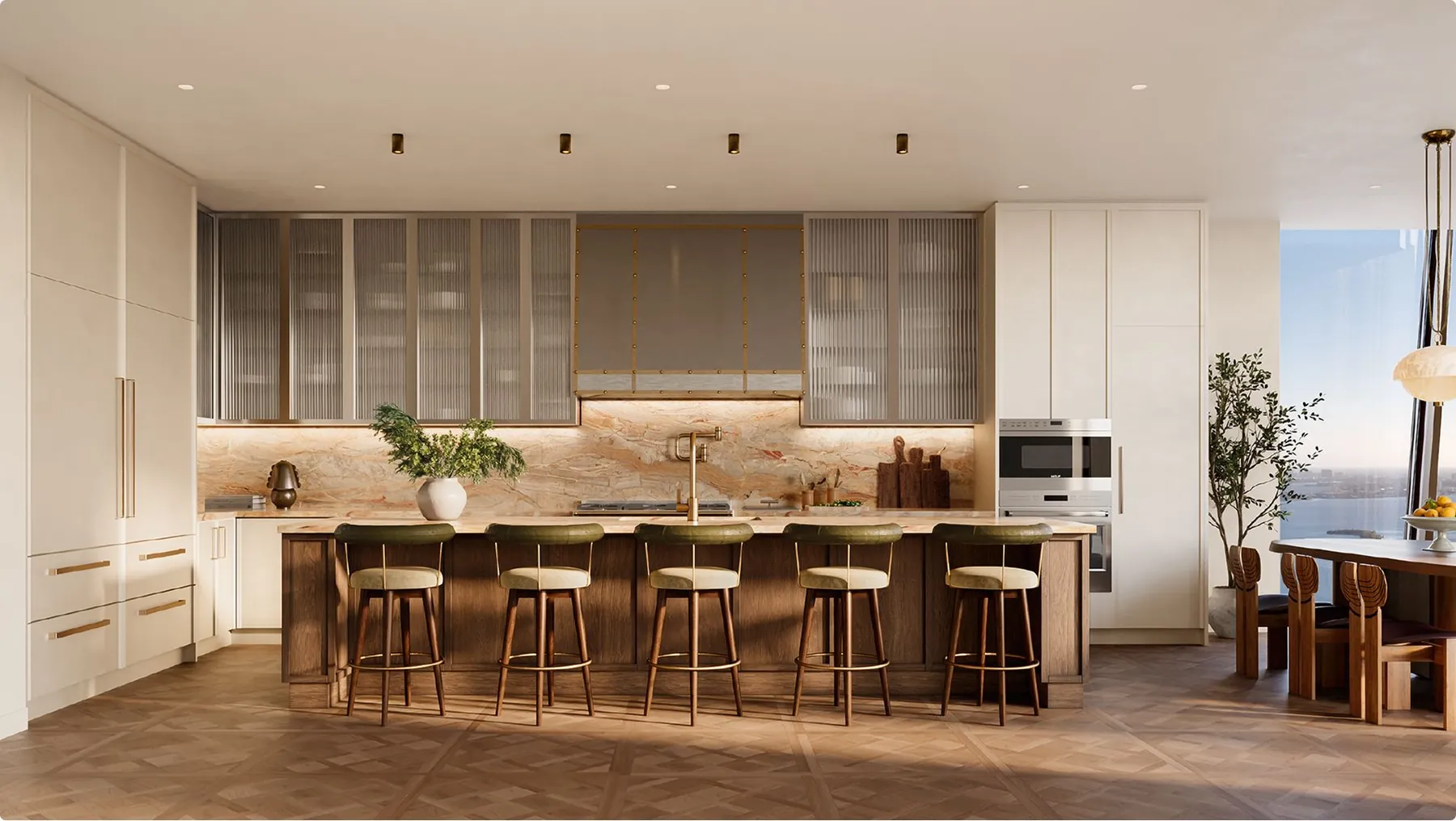 The chef&rsquo;s kitchen with a long island and glass-fronted cabinets