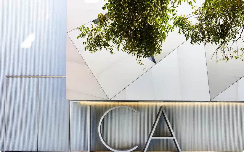 Signage of the Institute of Contemporary Art beneath a tree canopy