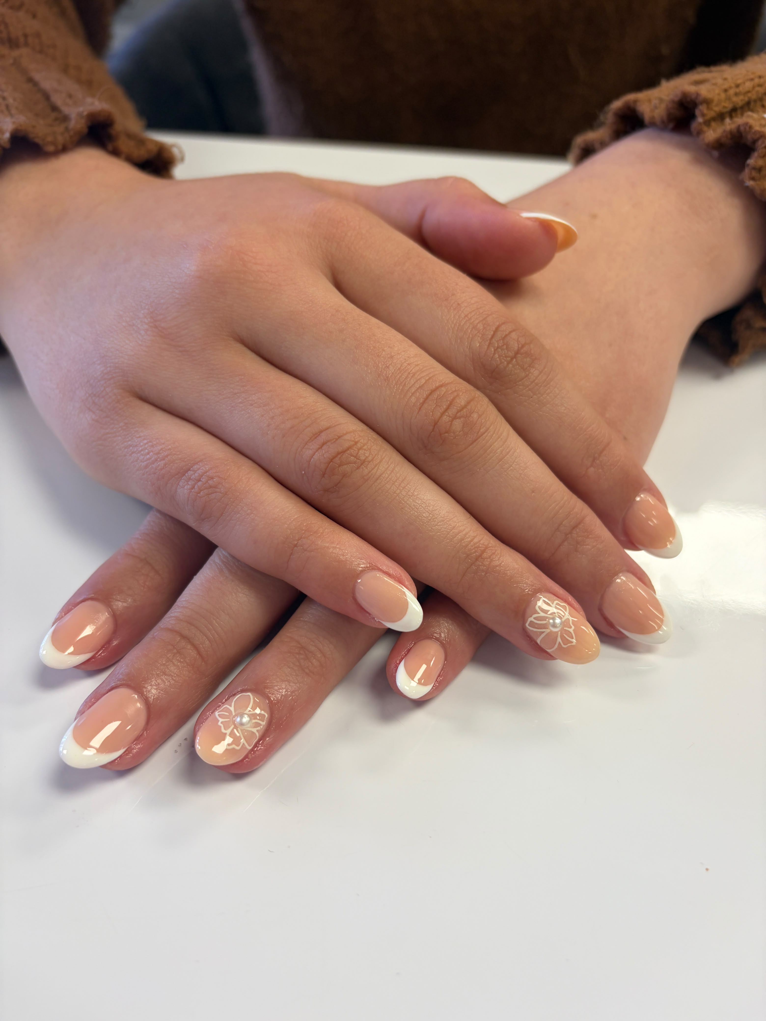 French manicure with delicate floral nail art by Craft Hair & Beauty