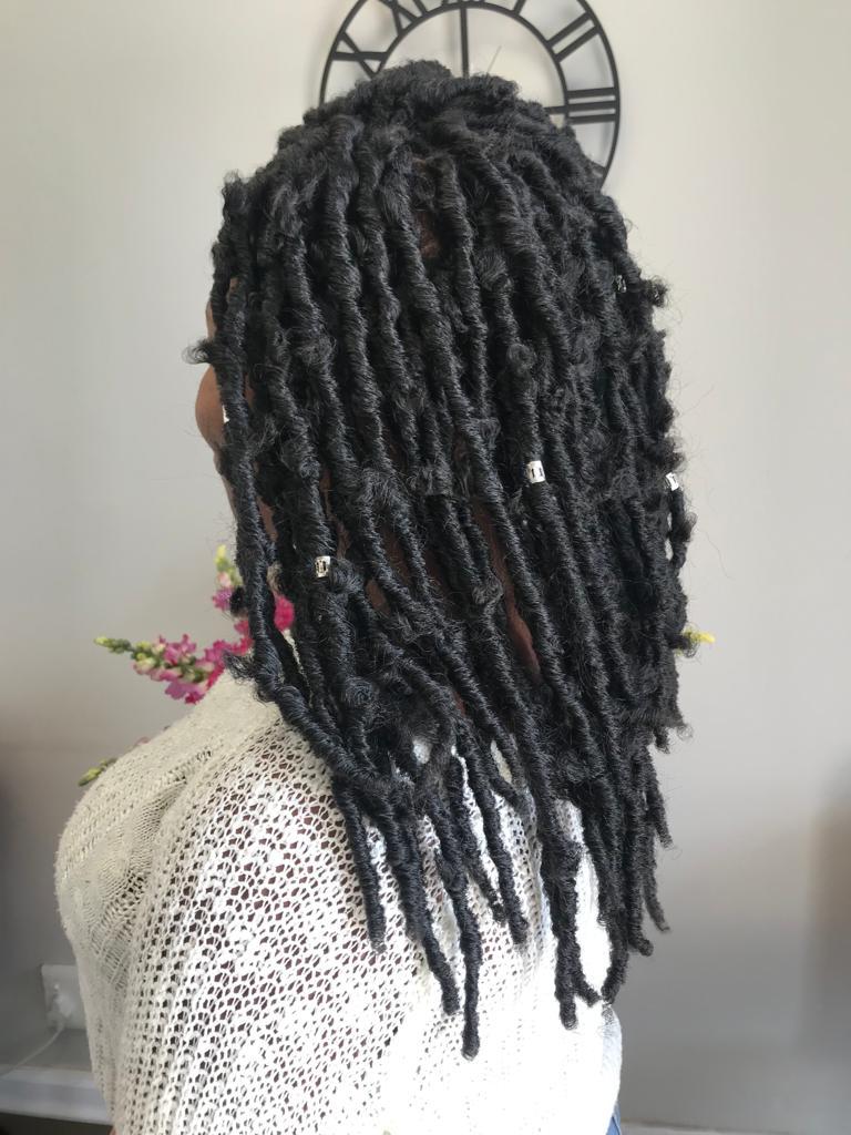 Finished loc hairstyle with decorative cuffs by Craft Hair & Beauty