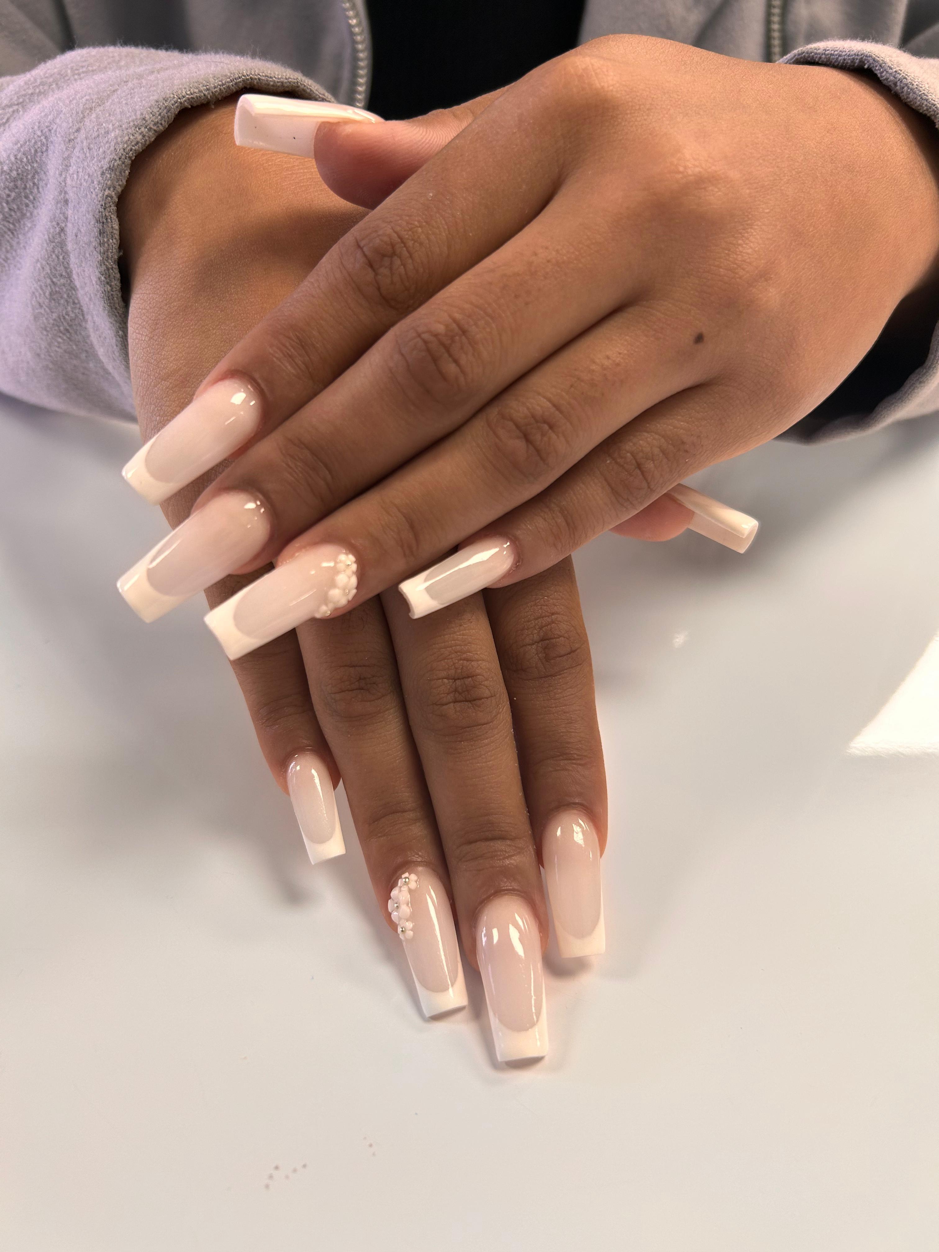 French-tip nails with pearl details created at Craft Hair & Beauty in Dainfern