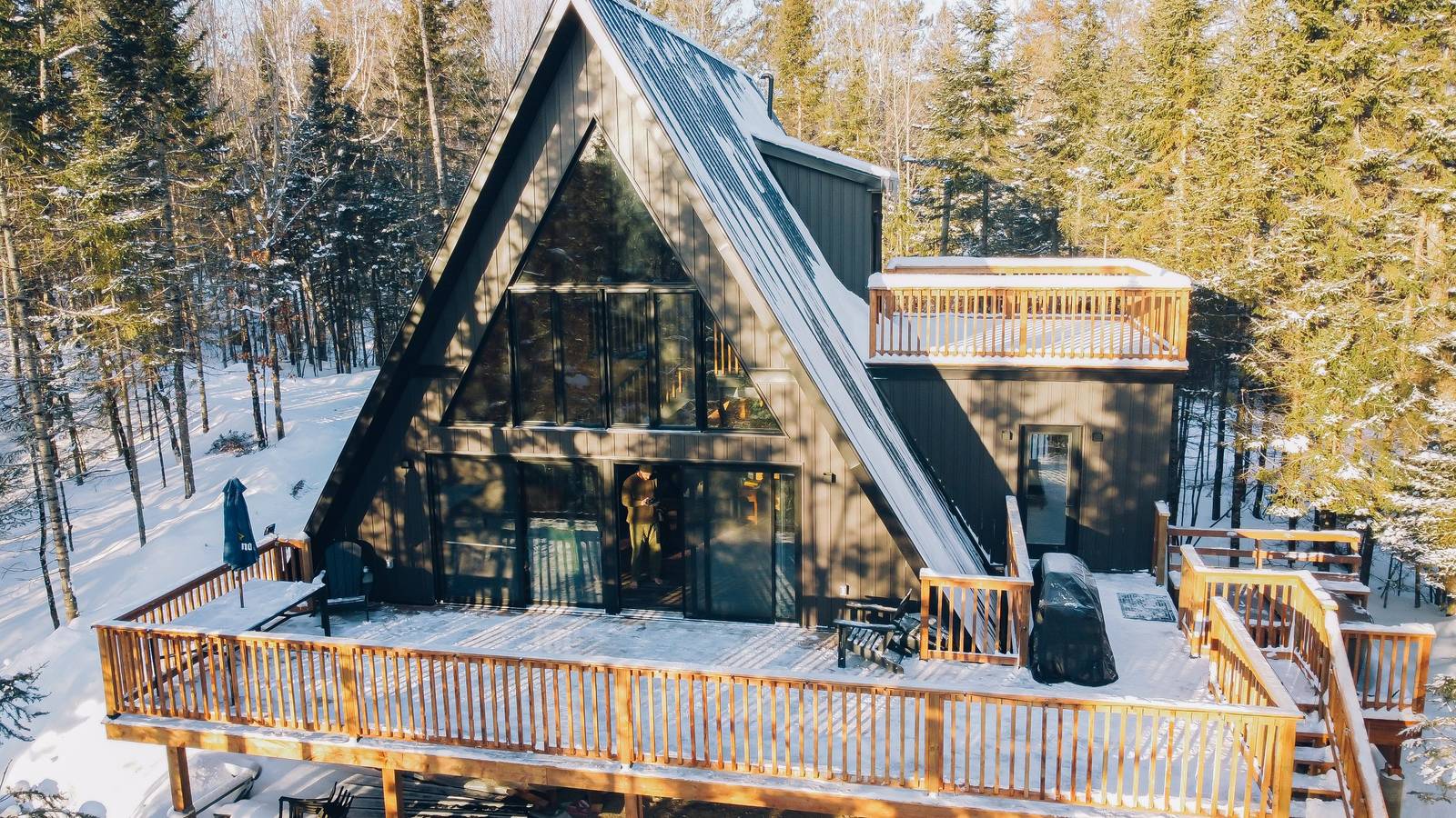The Lookout A-frame and wraparound deck in winter